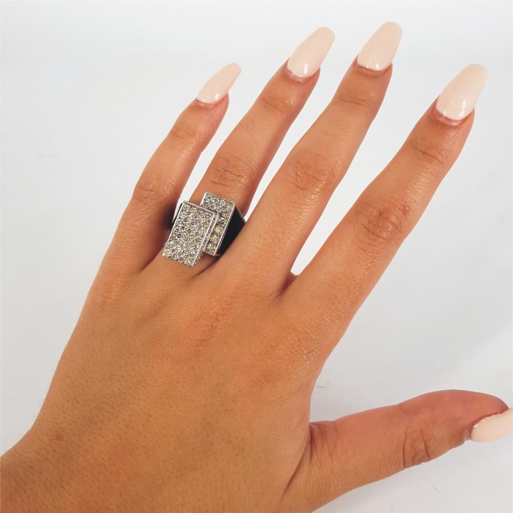 Strong, striking and pronounce, this ring says it all. Set in 18carat white gold and weighing 17.2 grams, this ring features 101 RBC Diamonds weighing a total of 1.52carat of KL/vssi quality. The ring size is N½ 