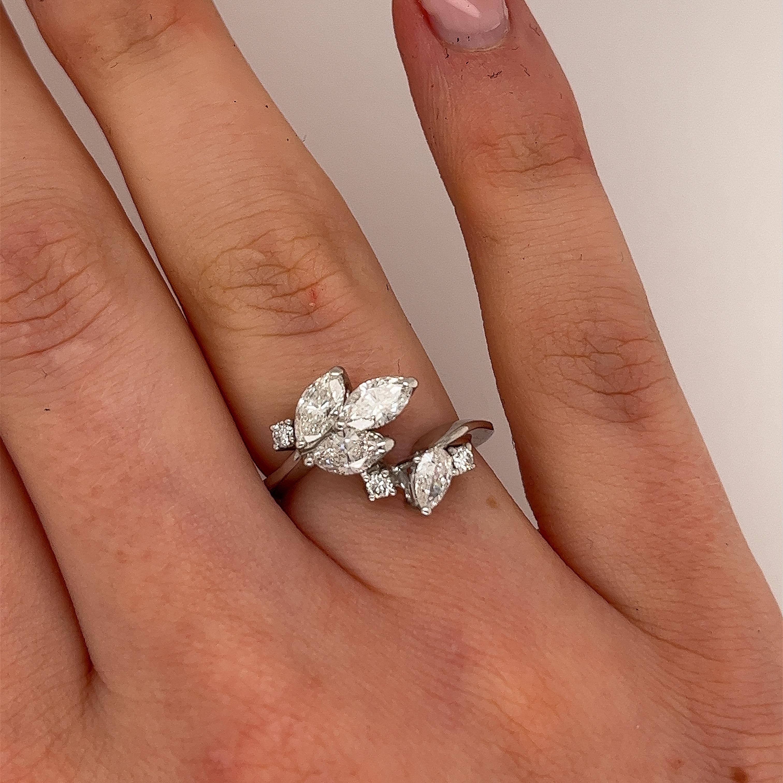 An elegant and unique diamond dress ring 
set with 3 marquise cut diamonds, 1 pear shape diamond 
and 3 round brilliant cut natural diamonds, 
with a total diamond weight of 1.30ct
in a 18ct white gold setting.
Total Diamond Weight: 1.30ct
Diamond