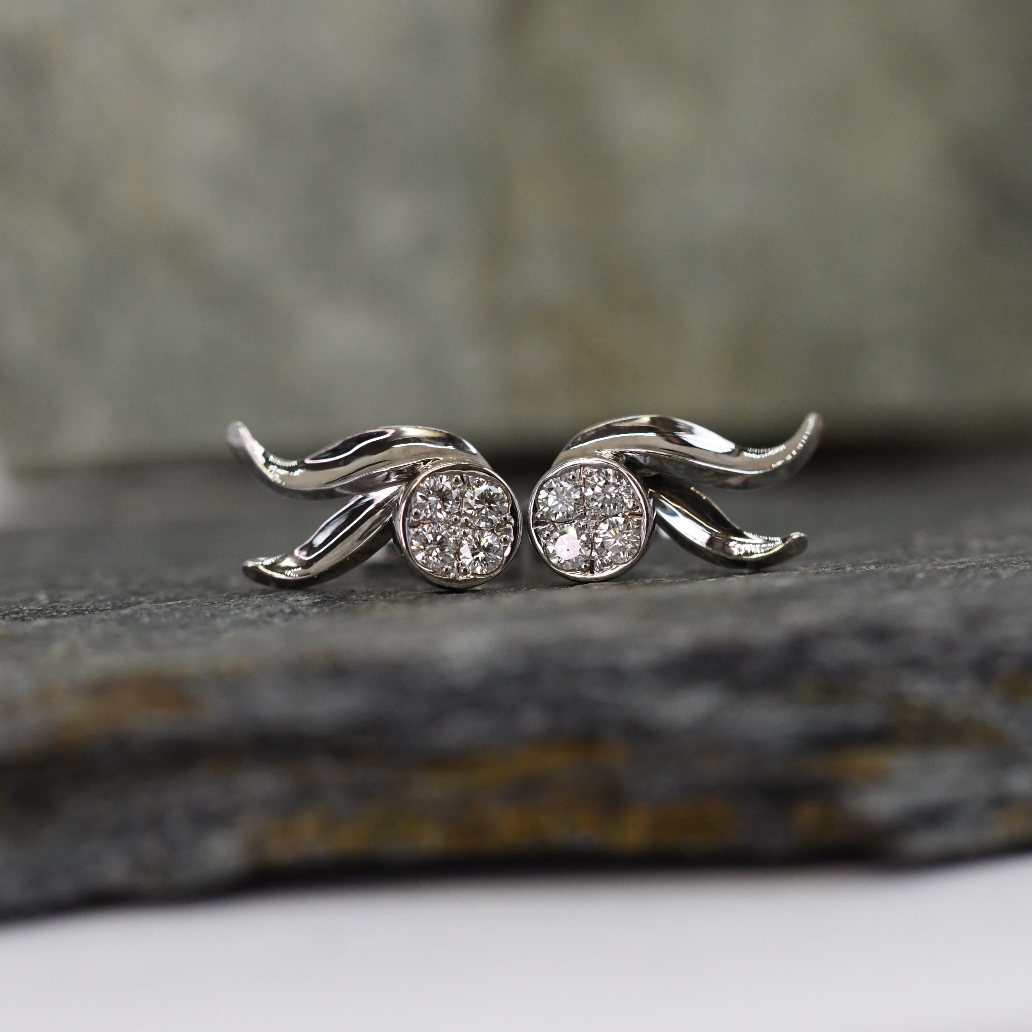 18ct Leaf Pave Set Diamond Stud Earrings.

Recently completed pair of handmade earrings entirely in 18ct white gold. 

Each with 4 pave set diamonds to add more sparkle than a single diamond.

1 of 1 unique design

Post and scroll type fittings.

8x