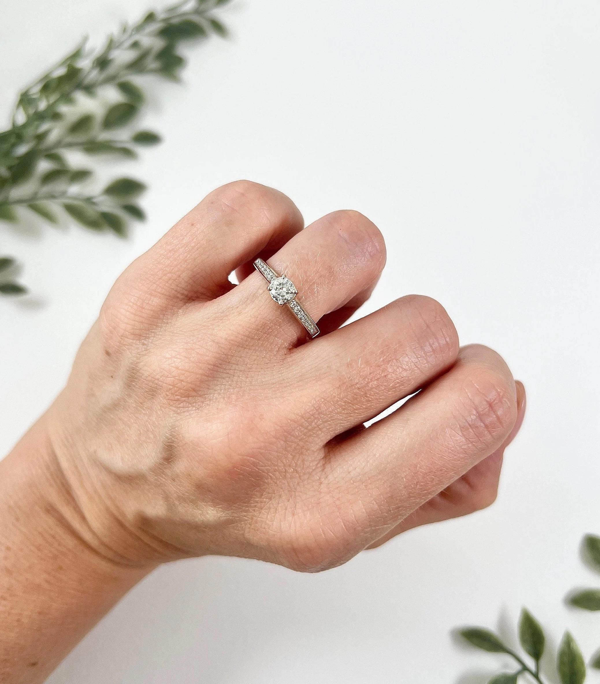 Antique Diamond Ring

18ct White Gold Stamped

Circa 1920s

Introducing a stunning 18ct white gold stamped engagement ring featuring brilliant cut stones that have been repurposed from a 1920s brooch. These exquisite stones have been meticulously