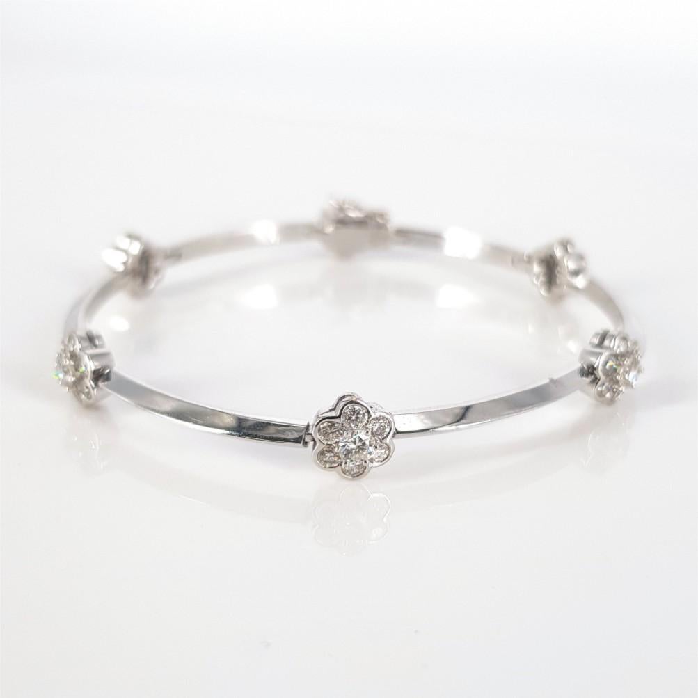 This Beautifully studded Flower Bracelet is set in 18 carat White Gold, weighs 13grams and measures 17cm in length. This Bracelet features 36 RBC Diamonds (GH vs-si) weighing 0.72carat in total and 6 RBC Diamonds (GH vs-si) weighing 0.60carat in