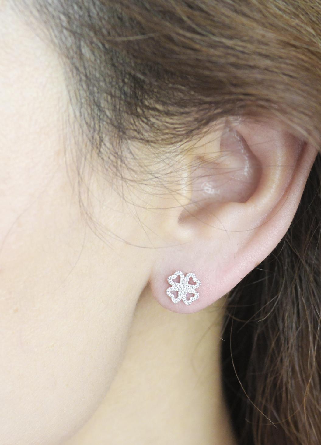 These are your lucky diamond earrings - with a delicate four-leafed clover shaped border set with tiny, sparkly round brilliant cut diamonds, these lightweight, sparkly earstuds are perfect for day to evening.  With a diamond content of a third of a