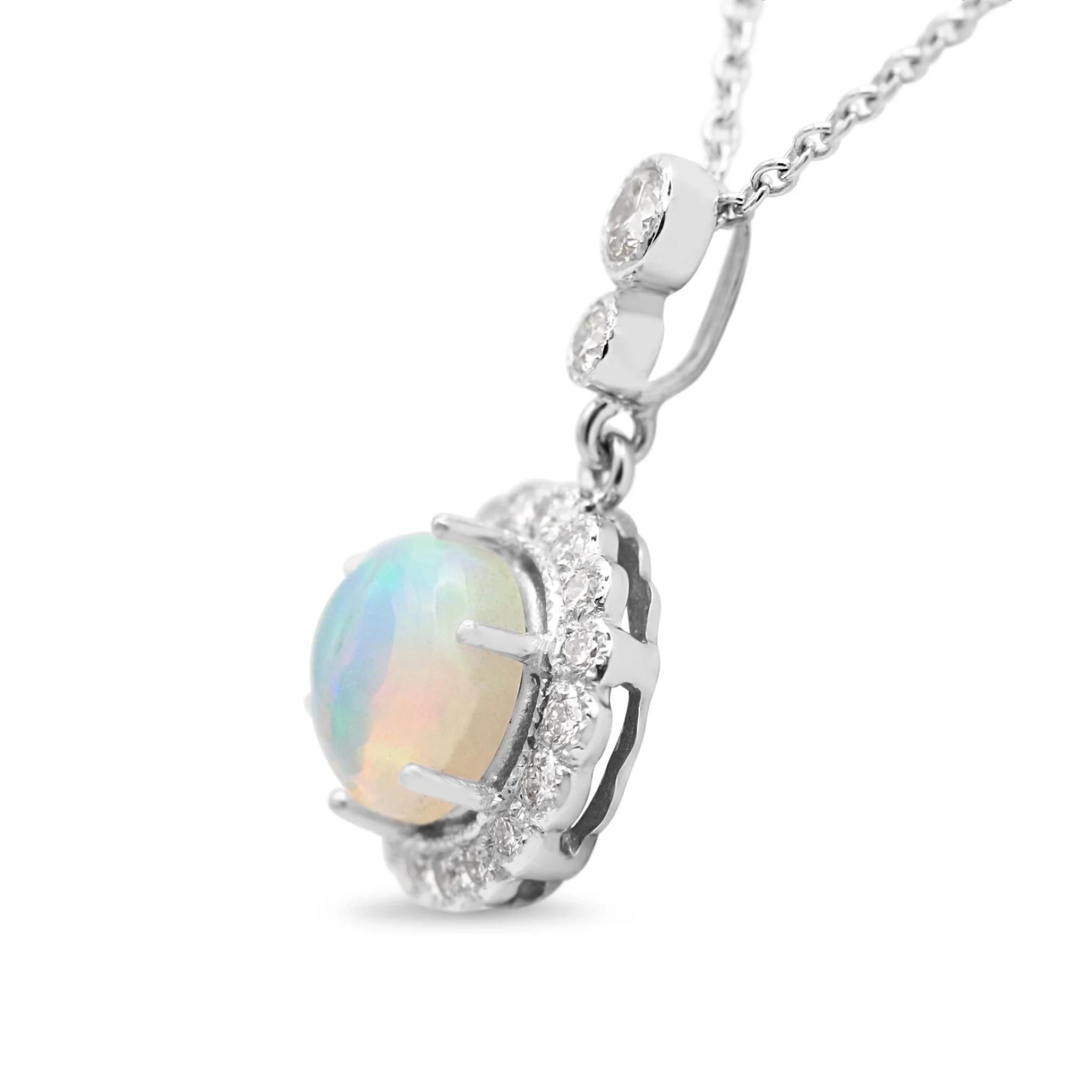Treat the special women in your life with the ultimate brand new gift – our unworn 18ct White Gold Diamond & Opal Cluster Necklace! This exquisite necklace is crafted from 18ct white gold and features a combination of a central 1.45ct cabochon opal