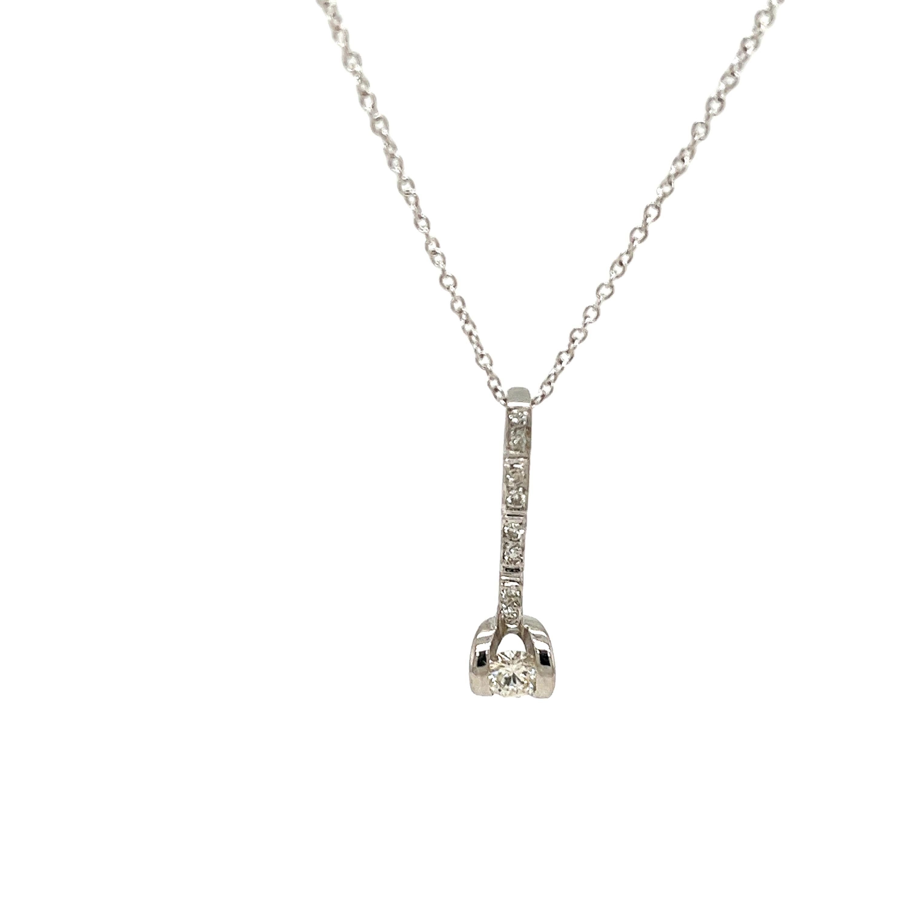 This elegant 18ct white gold diamond drop pendant is adorned with 0.22ct of sparkling round brilliant cut diamonds, set in a timeless drop design that adds a touch of sophistication to any outfit. 
The pendant is suspended from an 18