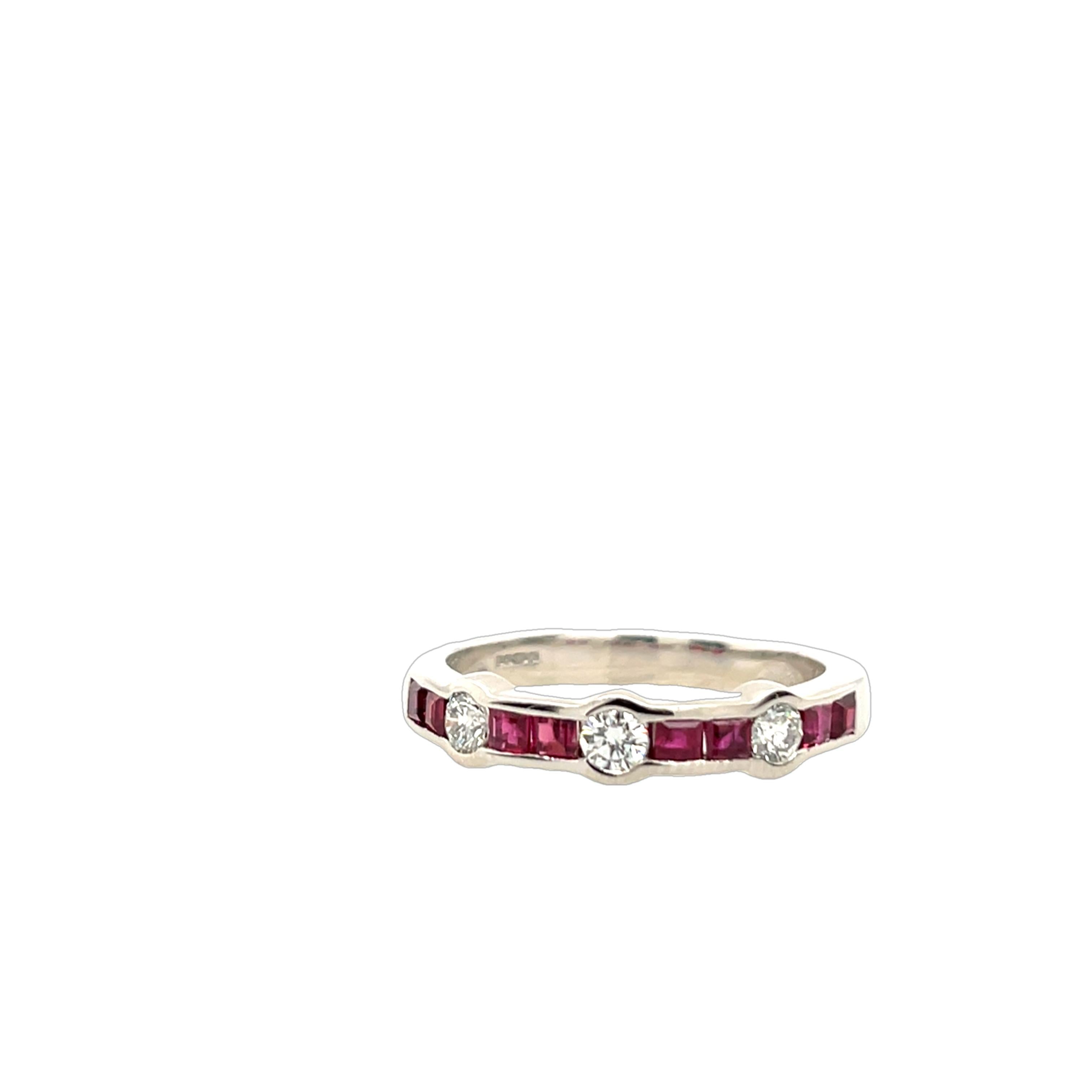 A sophisticated 18ct white gold ring, set with 3 dazzling diamonds 
and 8 vibrant square-cut rubies. 
The harmonious arrangement of gemstones exudes timeless elegance, 
making this piece a perfect choice for special occasions or everyday