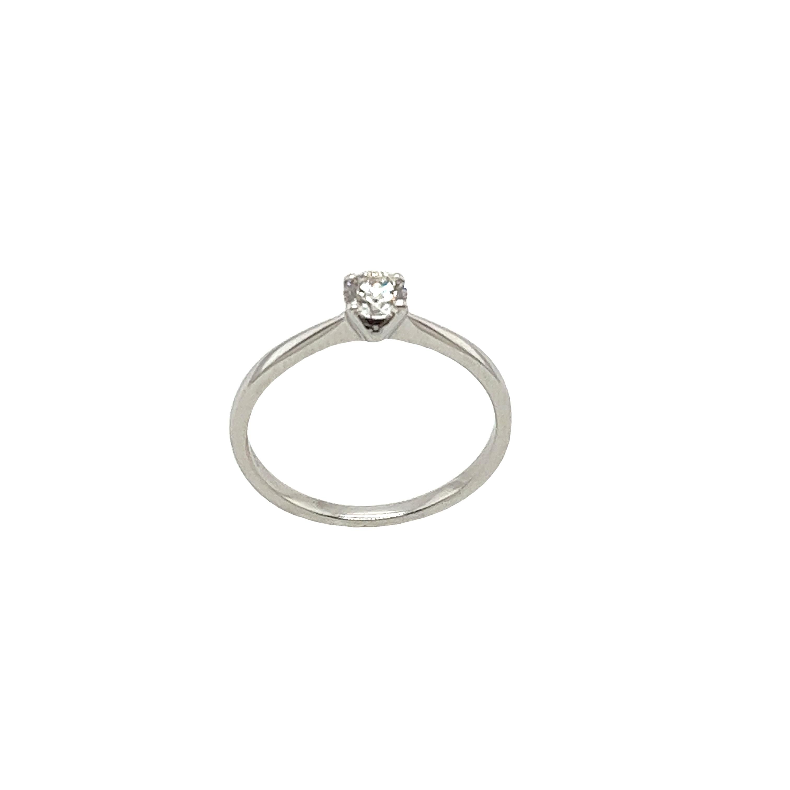 This gorgeous pre-loved solitaire diamond ring set with 0.31ct G/SI2 round brilliant cut diamond  
set in 18ct white gold setting can make a perfect engagement ring.

Total Diamond Weight: 0.31ct
Diamond Colour: E
Diamond Clarity: SI1
Width of Band: