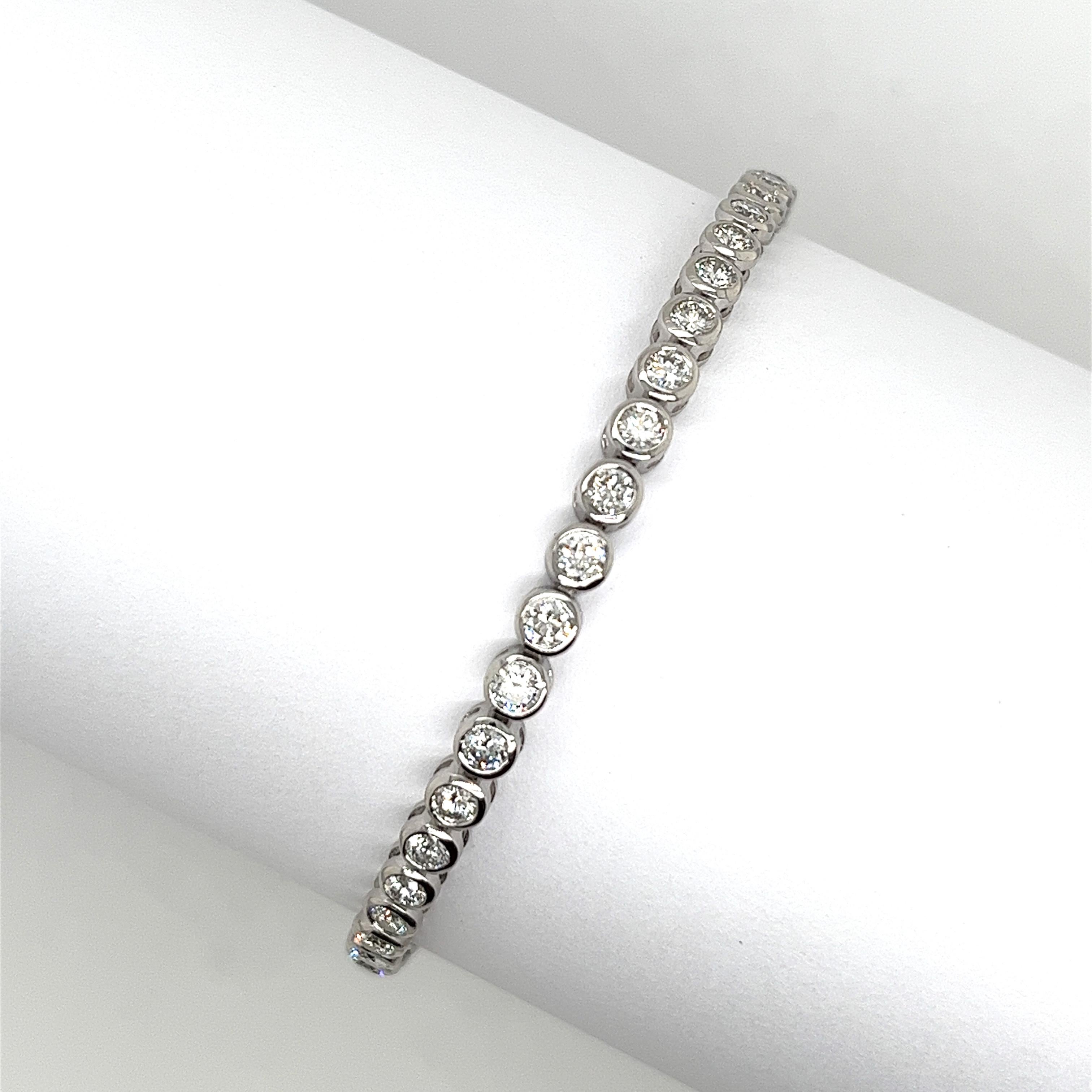 A beautiful natural diamond tennis bracelet in 18ct white gold, 
features a total diamond weight of 3.50ct natural round brilliant cut diamonds SI1 clarity H colour in a bezel setting.
This is a fantastic piece of jewellery that will last a lifetime