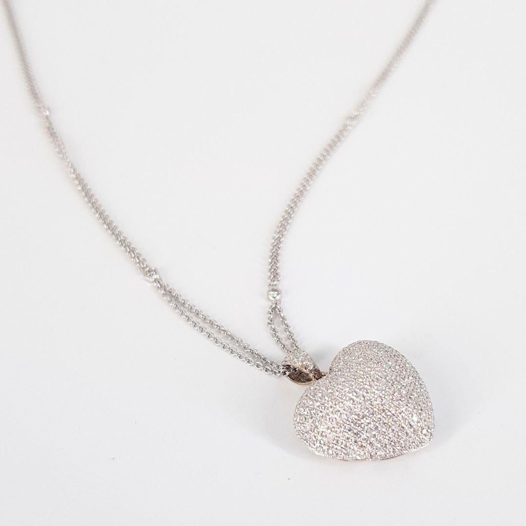 Round Cut 18ct white gold diamonds by the mile necklace and puff pave heart pendant For Sale