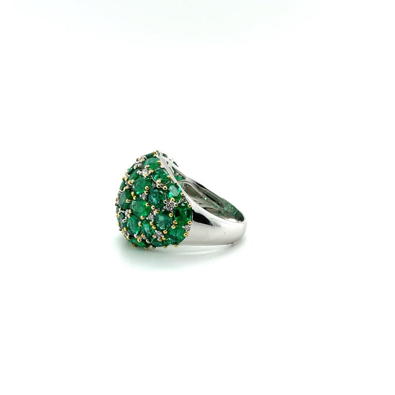 An emerald multi cluster dress ring