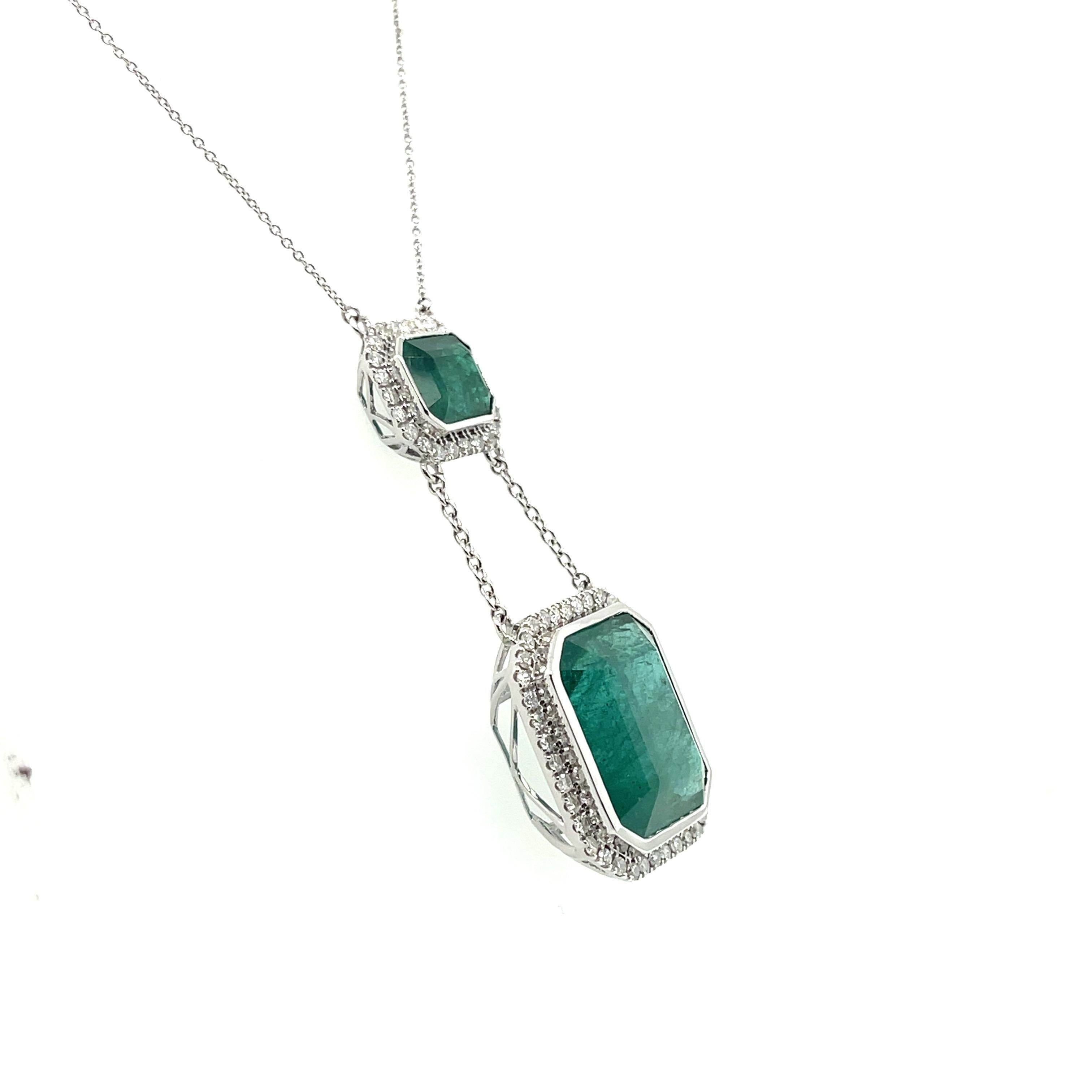 Natural Emeralds and Diamonds, crafted into a beautiful double drop pendant and diamond necklace, complimented by a stunning polished finish design.

Two Emeralds, 24.17ct ctw, 9.82mm x 8.08mm x 6.08mm - 17.67mm x 14.75mm x9.64mm *estimated whilst