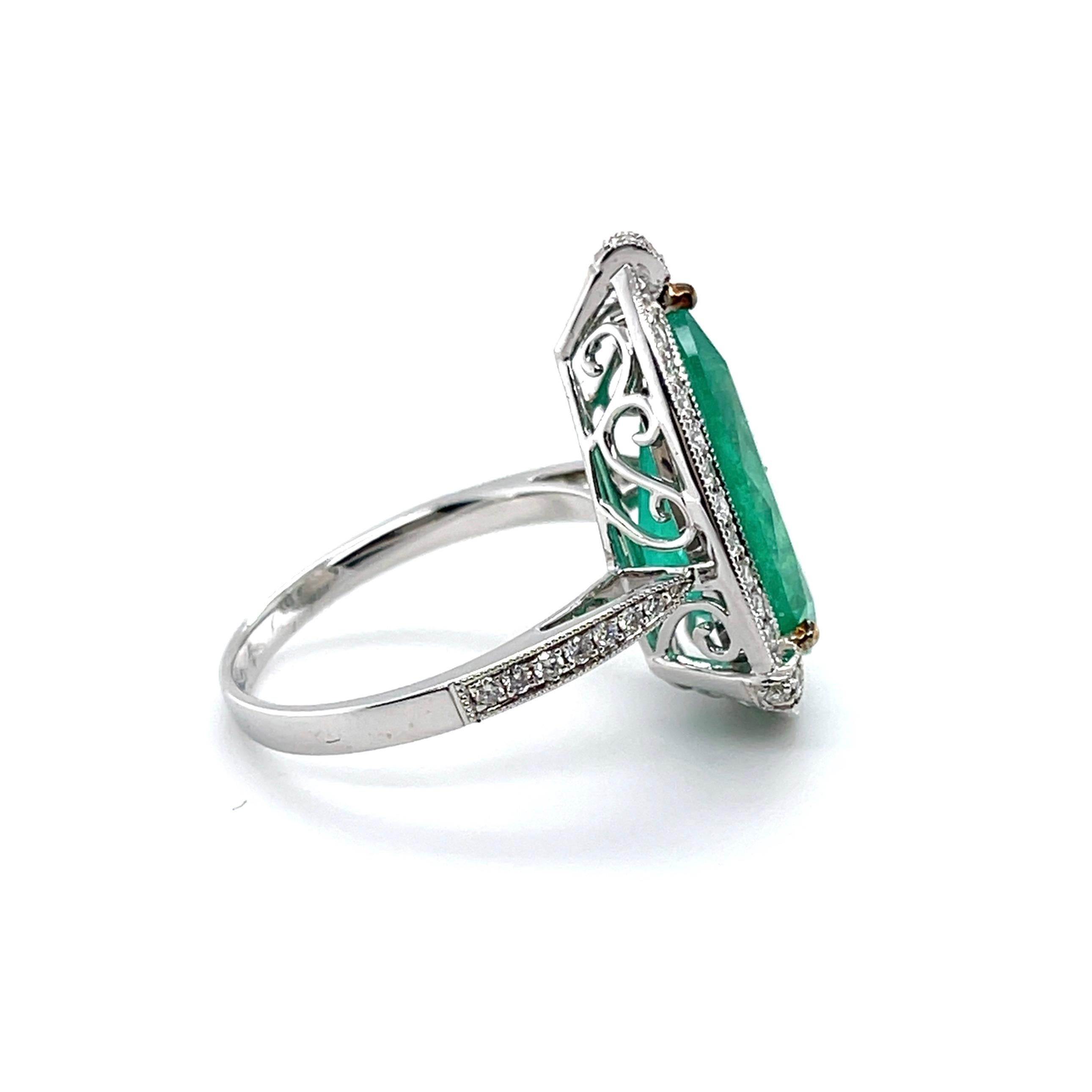 Pear cut Colombian (based on my opinion) emerald, crafted in eighteen karat white gold, featuring a beautiful selections of forty-nine claw set round brilliant cut diamonds. complimented with a polished finish design,

Emerald weight: 5.99ct