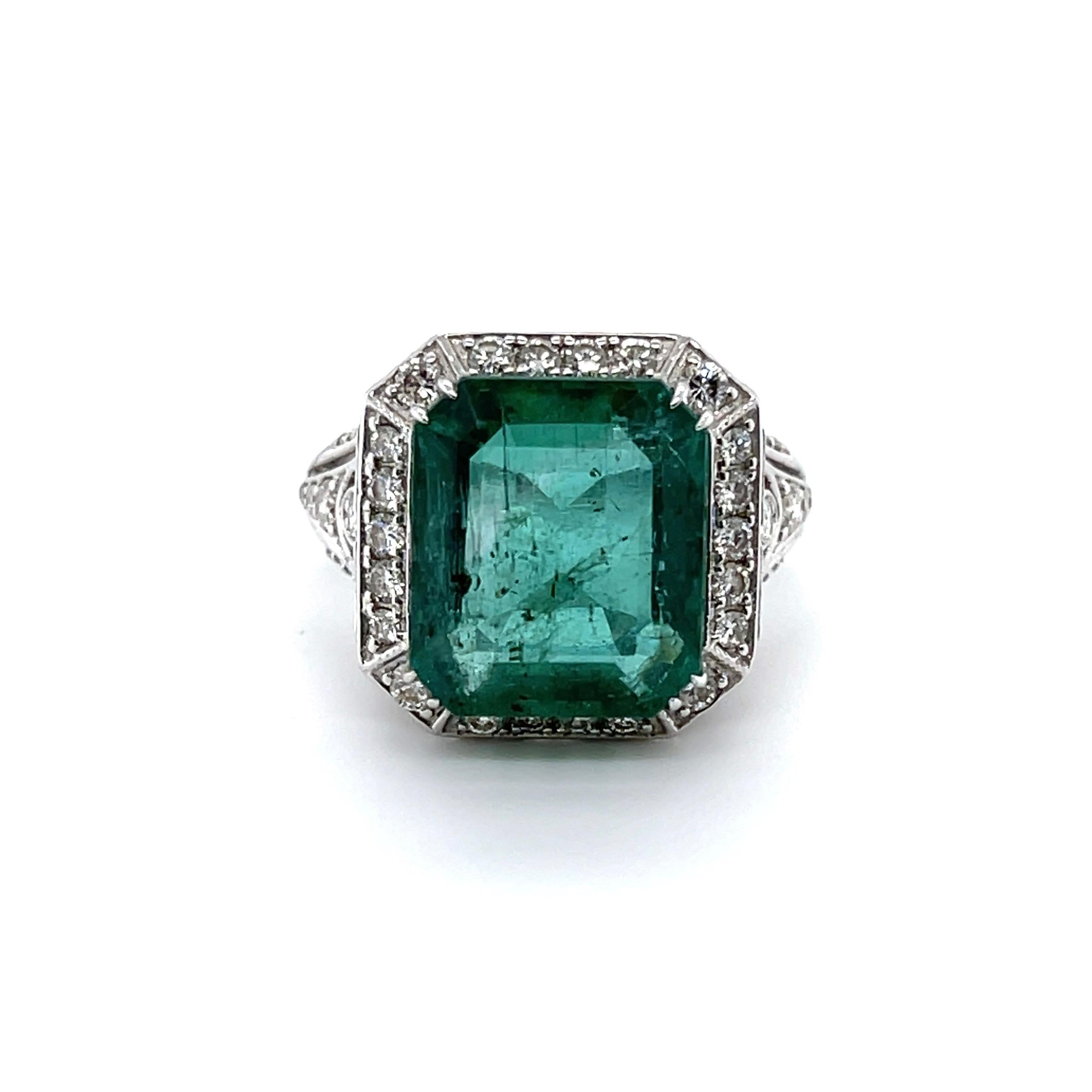 Emerald cut natural emerald, crafted with Eighteen Karat White Gold, featuring a stunning one hundred bead set single cut and round brilliant cut diamonds, complemented by a polished finish design. 

Emerald Weight: 7.86ct

Emerald