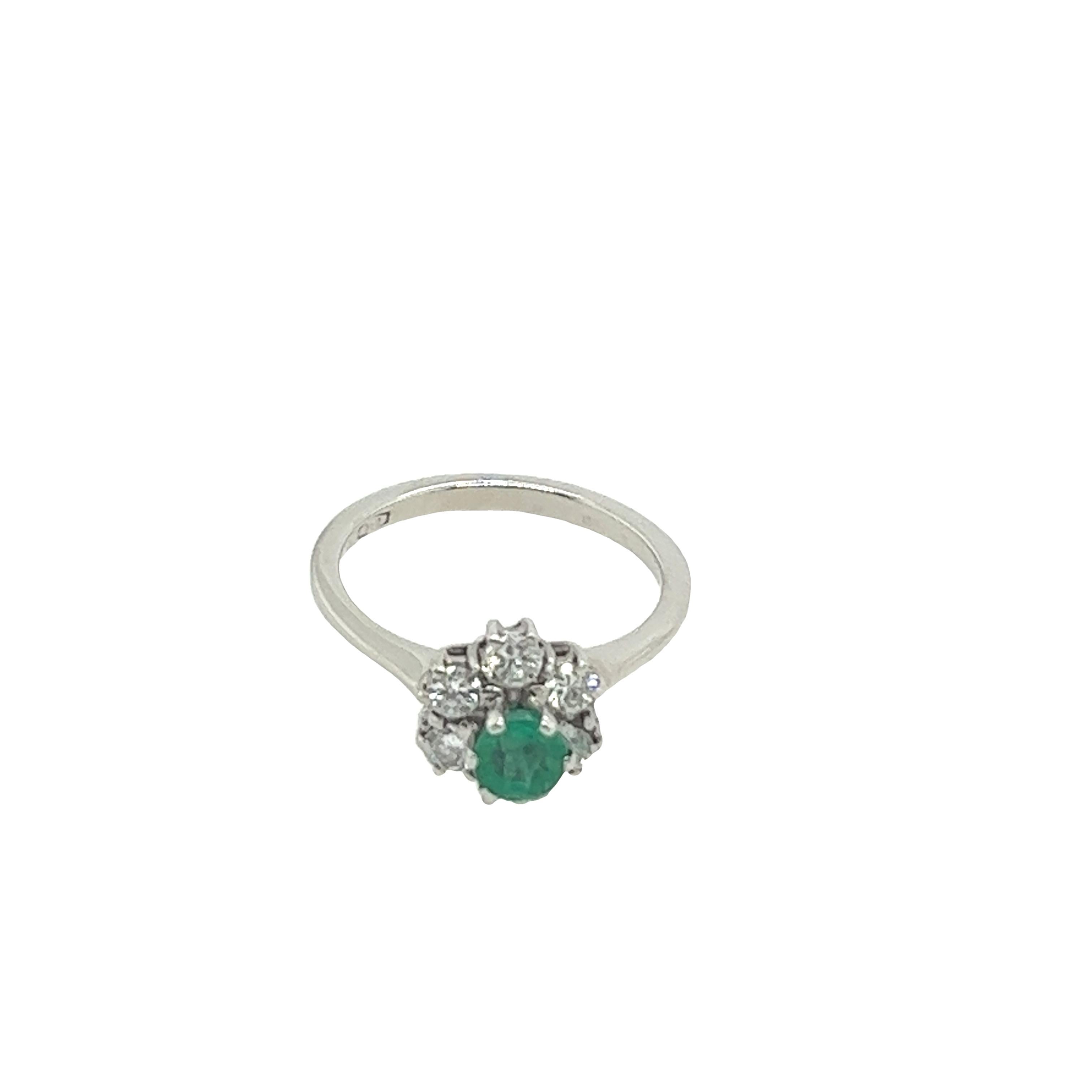 This gorgeous 18ct white gold emerald ring is set with 0.35ct natural round diamonds. 
The emerald is a rich green, the diamonds complement the emerald, and together they symbolize the eternal love.
Total Diamond Weight: 0.35ct 
Diamond Colour: