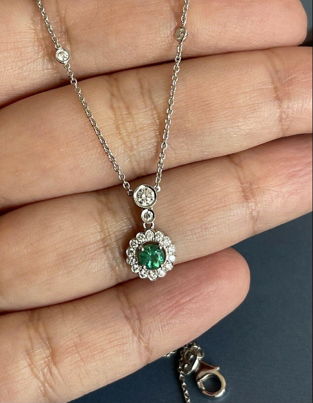 High jewellery meets Classic

One a kind necklace with by the yard chain set with round halo pendant

AAA Colombian deep green emerald

Diamond are:

Colour : F

Clarity : VS1

Hallmarked 750 for Gold

18 inch long chain also hallmarked 750 for