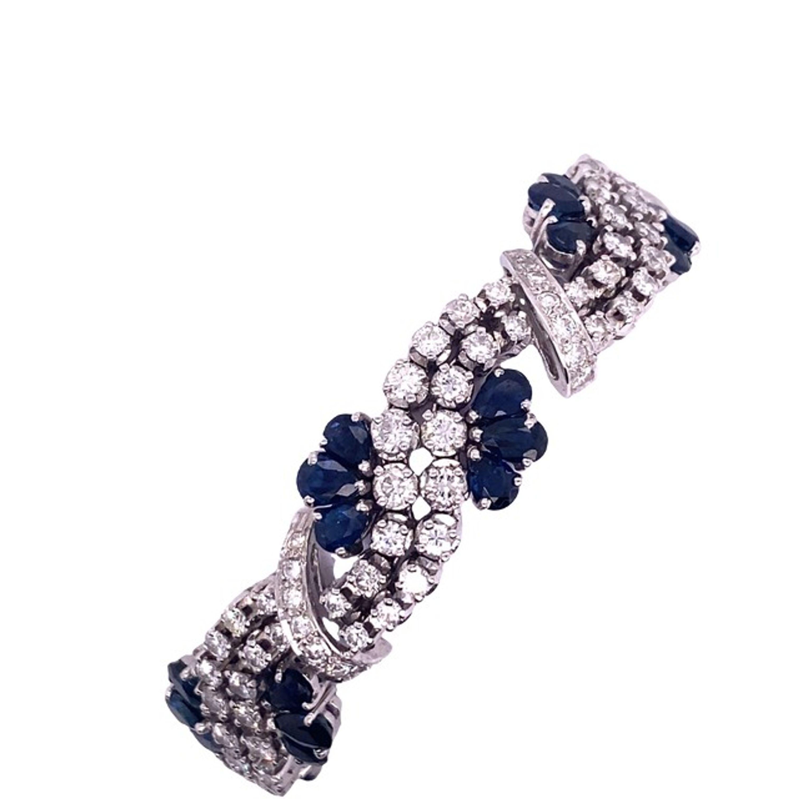 This luxurious and extravagant bracelet features 6.50ct of round diamonds and 6.0ct of fine-quality sapphire. The beautiful 6.5ct round diamonds are set in 2 rows in the center. This bracelet is made of 15t white gold (69.56% gold) and locks