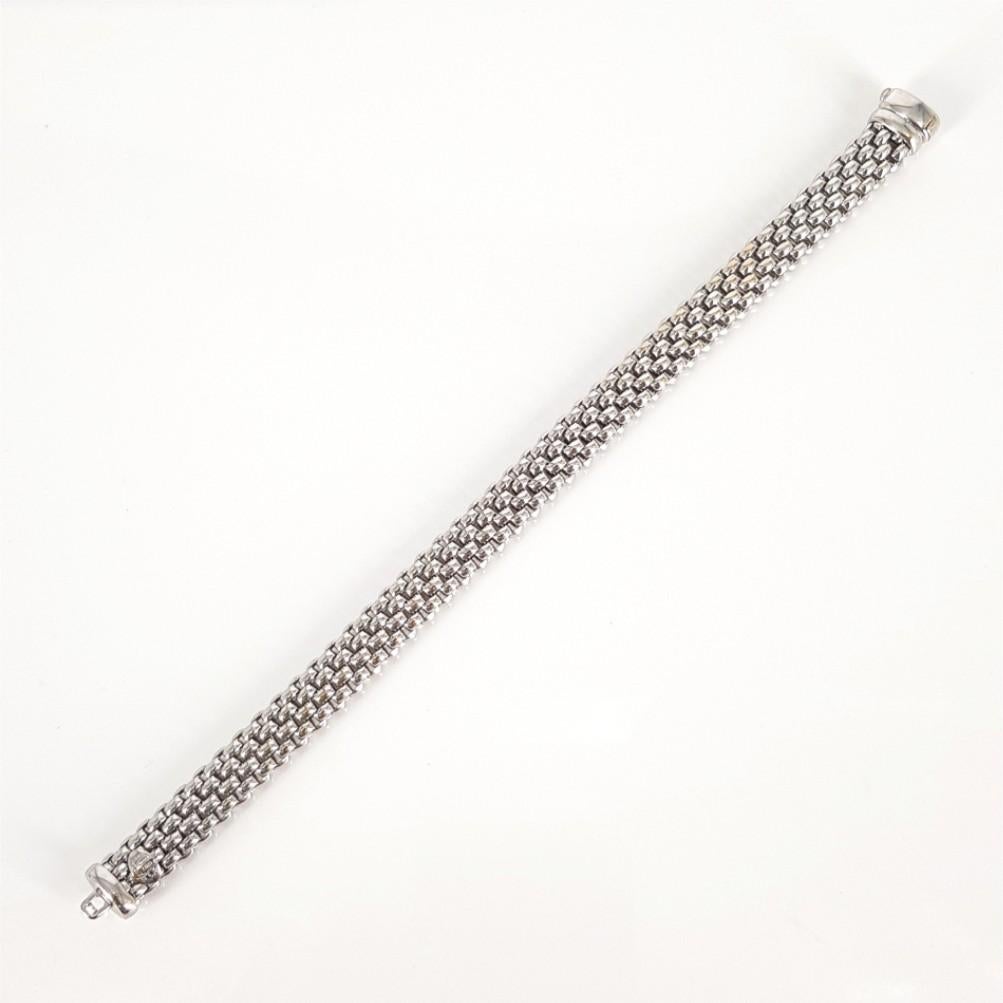 This stunningly woven flexible tube Fope bracelet is set in 18carat white gold and weighs 28 grams. This elegant bracelet measures 8mm in width and 19cm in length. 