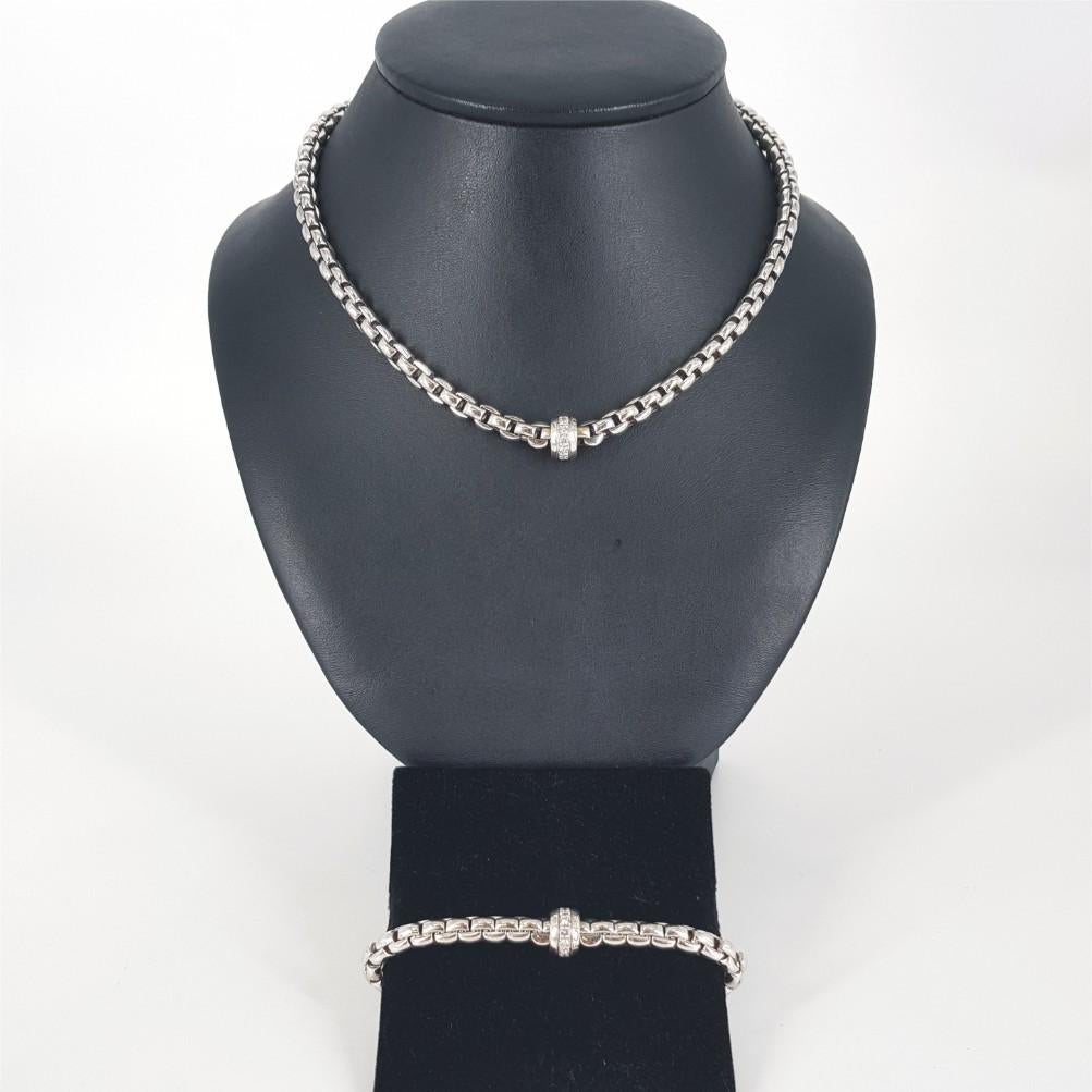 An elegant Fope parure of jewellery, comprising a necklace and bracelet.
This very beautifully woven necklace & bracelet are both set in 18K white gold.

Necklace Details: 	11 Diamonds (GH vs-si) weighing 0.55 carat in total
                        