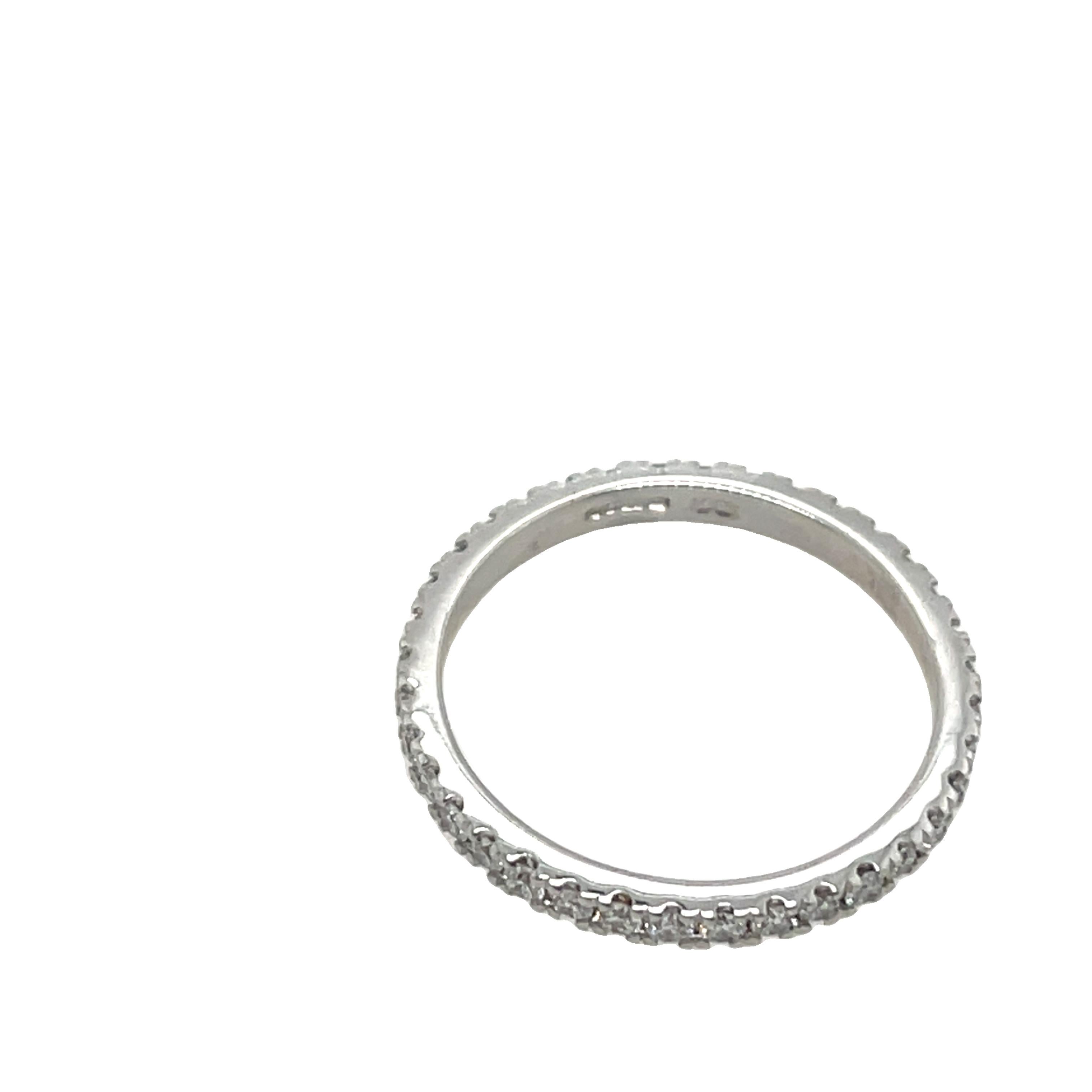 Elegant and timeless, this beautiful full eternity ring 
is crafted from 18ct white gold and adorned with 0.50ct of natural round diamonds, expertly set across the top of the band. Perfect as a wedding band, anniversary gift, or a stacking ring for