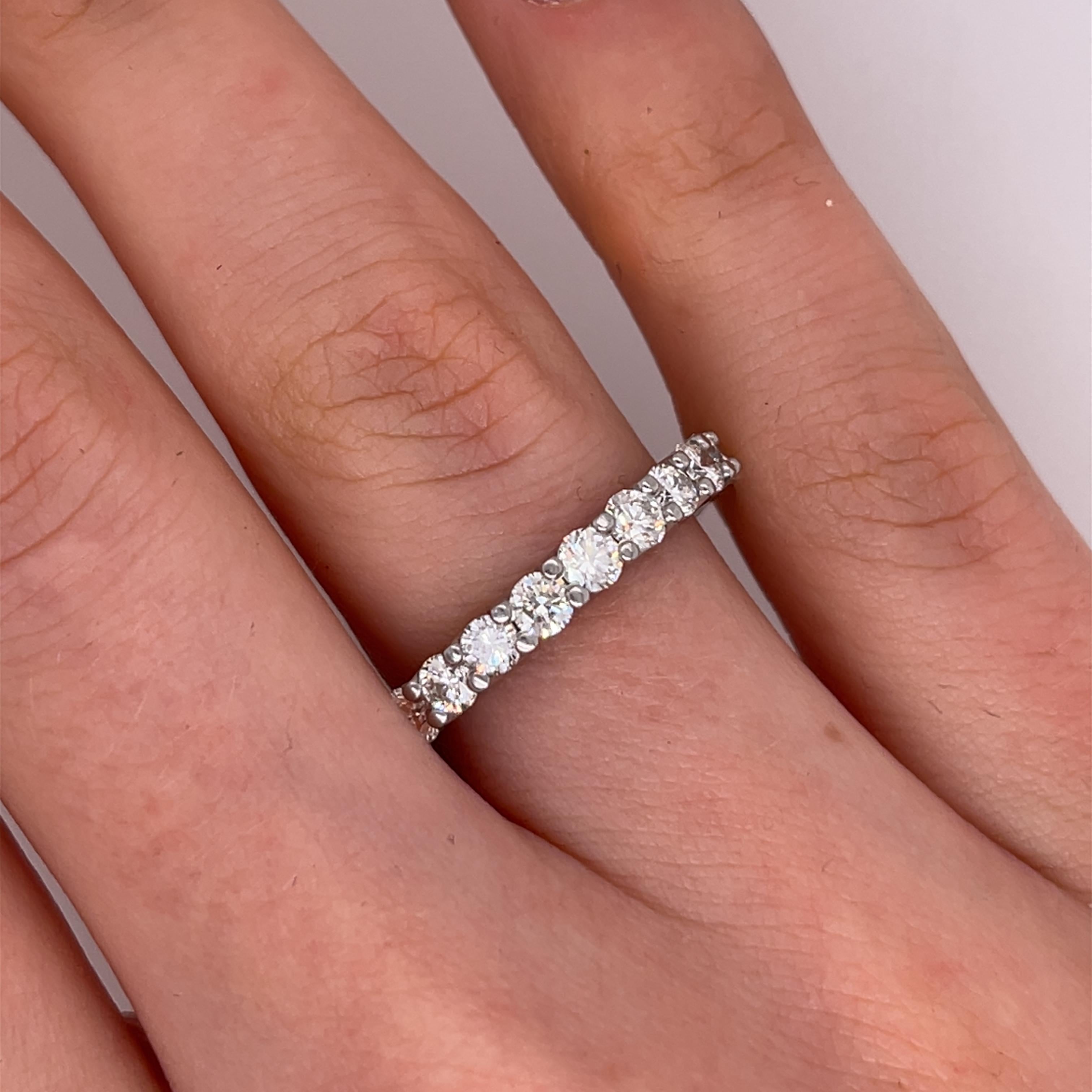 Stunning and timeless, this exquisite full eternity ring 
is crafted in luxurious 18ct white gold and 
set with a continuous circle of natural round brilliant cut diamonds, totaling 2.33ct. The seamless design symbolizes eternal love, making it