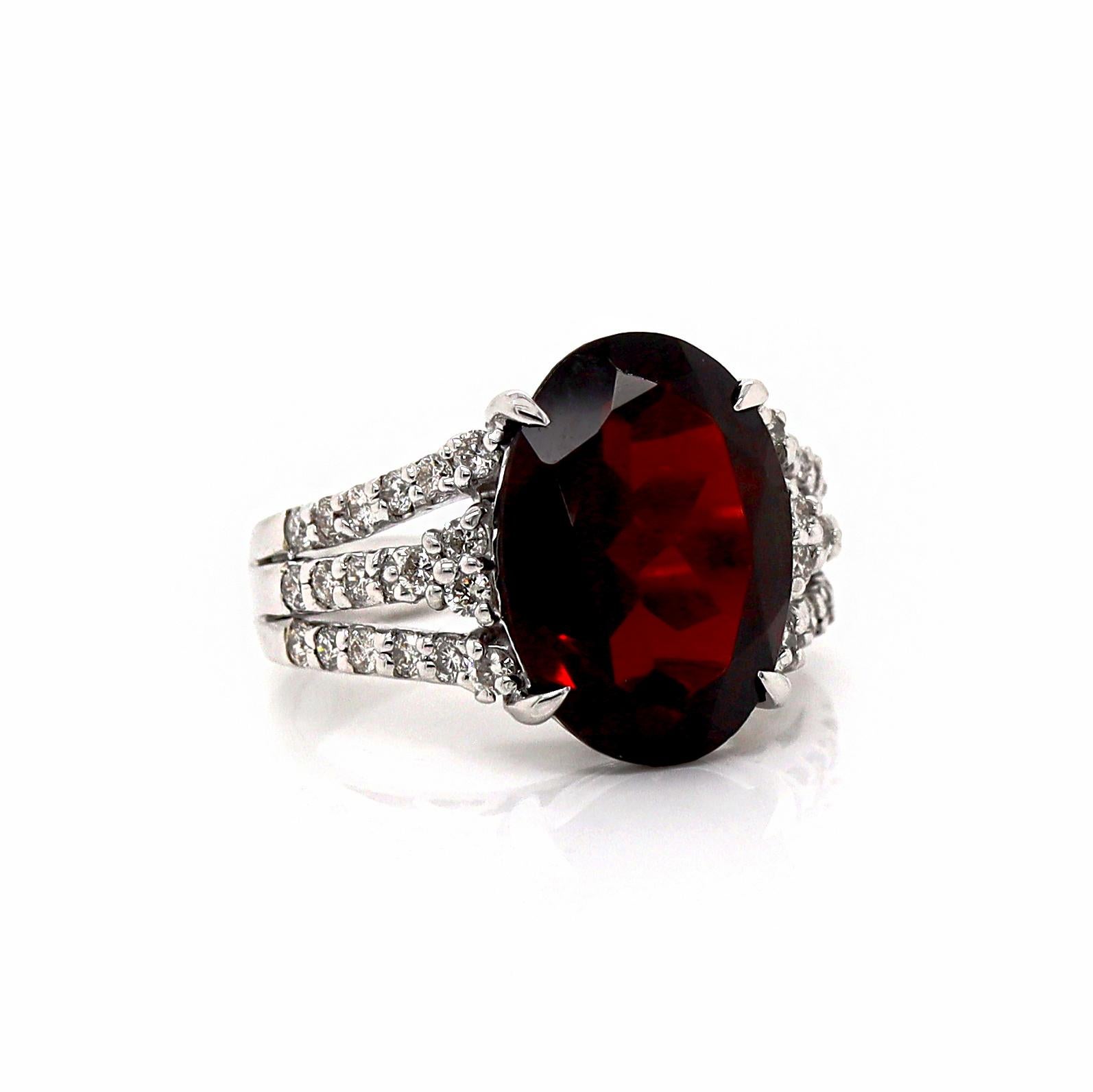 18CT White Gold Garnet And Diamond Cocktail Ring

This striking cocktail ring features a central oval cut garnet in a rich brownish red hue, exuding warmth and elegance. Flanking the Garnet are 38 round brilliant cut diamonds, creating a dazzling