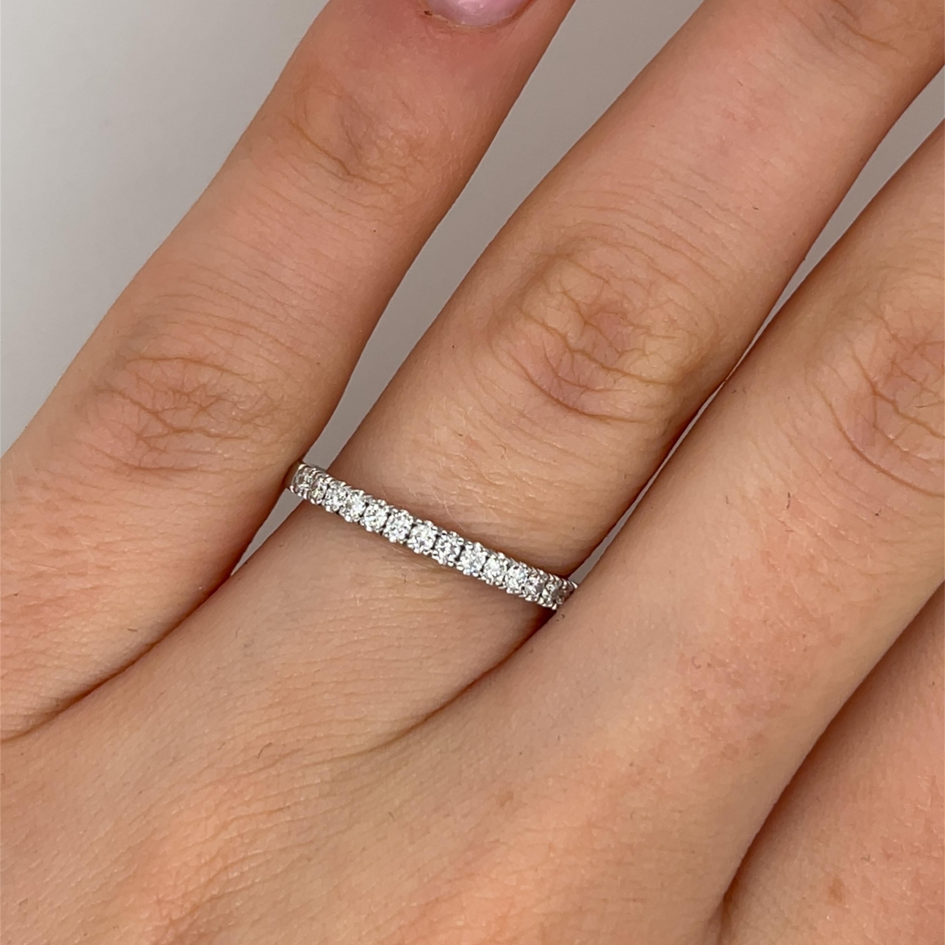 Elegant and timeless, this beautiful half eternity ring 
is crafted from 18ct white gold and adorned with 0.28ct of natural round diamonds, expertly set across the top of the band. Perfect as a wedding band, anniversary gift, or a stacking ring for