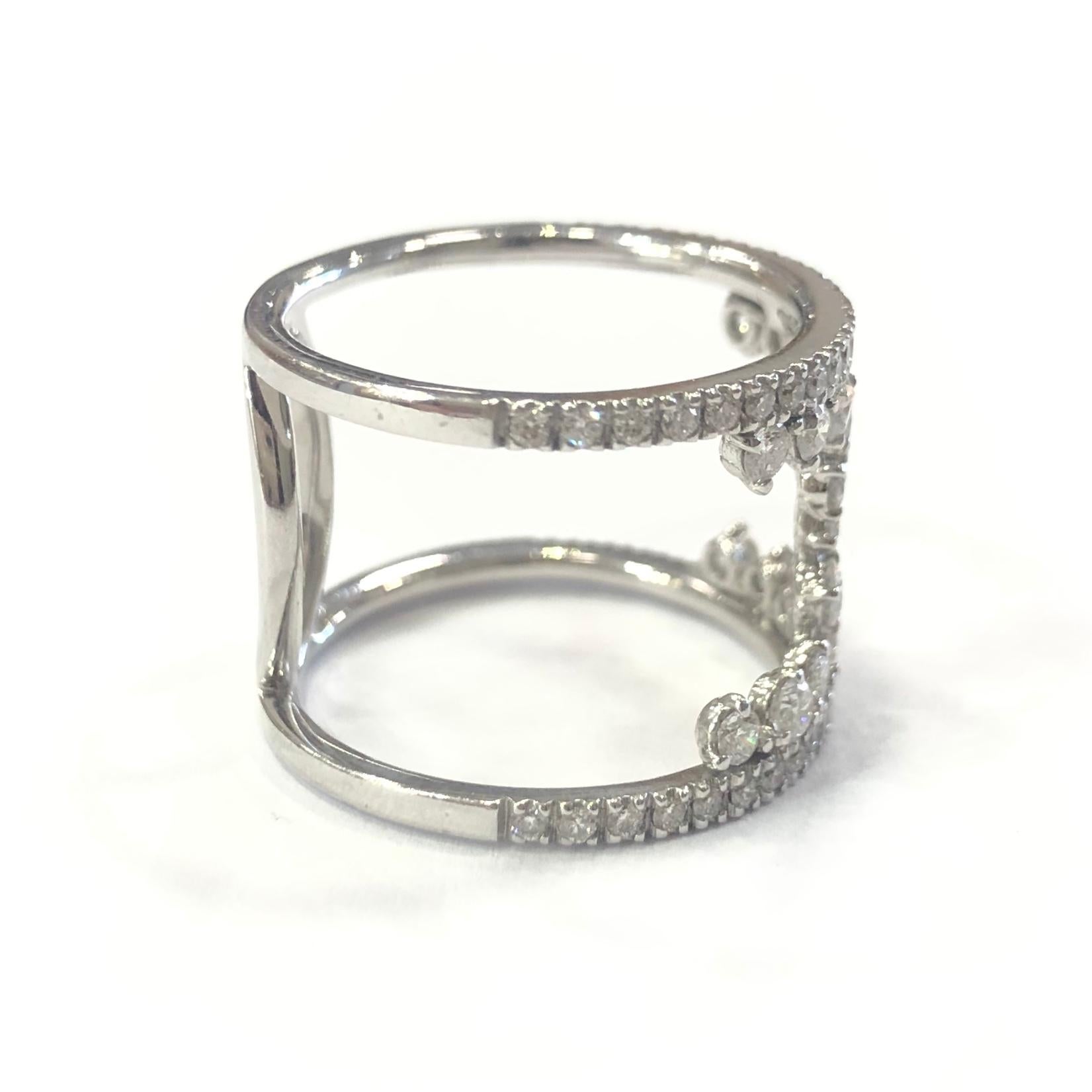 18ct White Gold Handmade Diamond Scatter Band Ring. Set with two half bands of round brilliant cut diamonds, with 19 round brilliant cut diamonds joining the two bands.

Approximate total Diamond weight : 2.00ct
Total weight : 5.2g
Ring size : M
