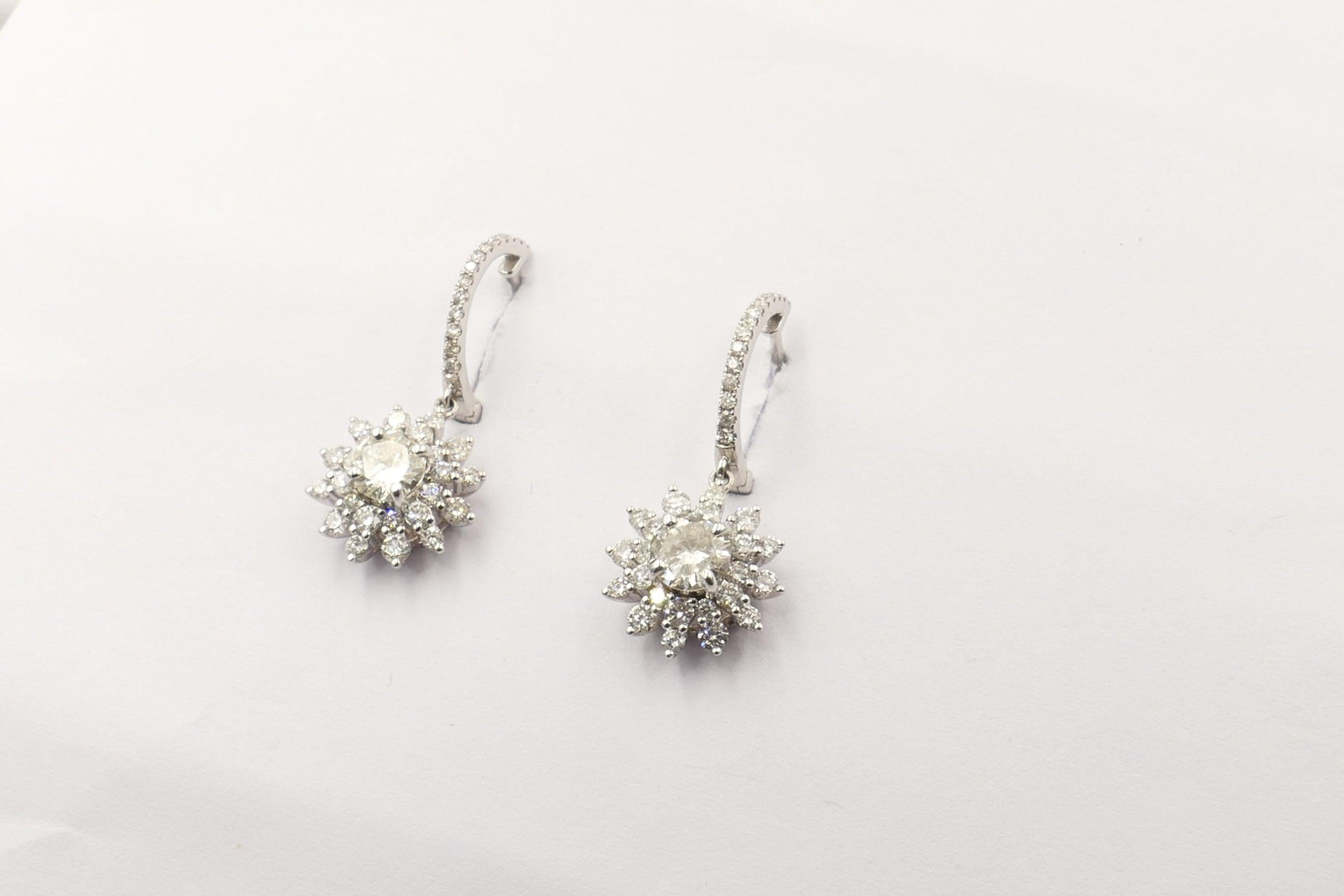 2 Round Brilliant Cut Diamonds, ColourF/G, Clarity SI1-SI2, individually 4 claw set, are surrounded by 76 Round Brilliant Cut Diamonds, Colour G/h, Clarity SI1-SI2 & micro-claw set in these very sparkly very wearable brand new Earrings.
The Earrings