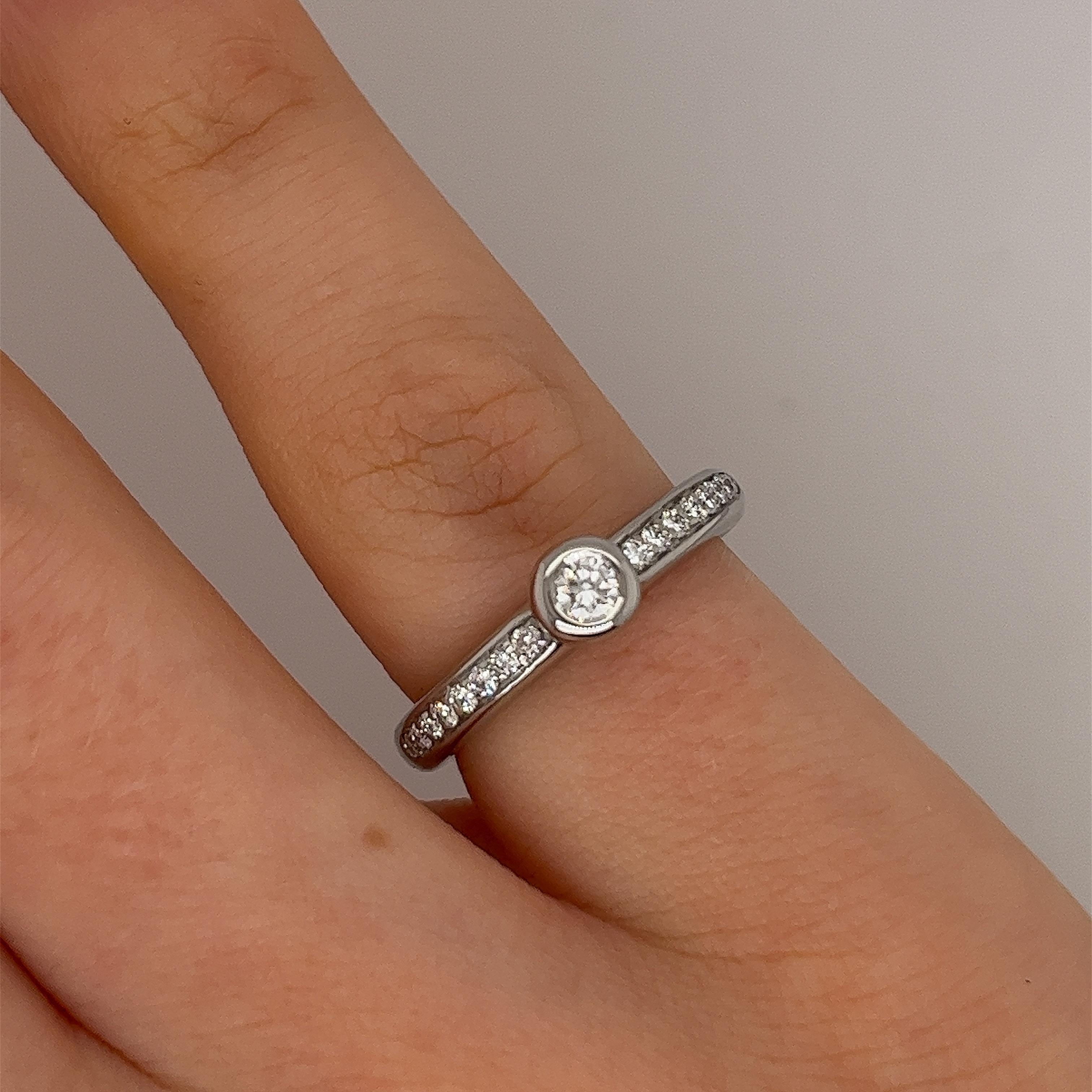An elegant diamond ring for your engagement, 
set with 0.10ct centre stone and 16 small diamonds on shoulders, 0.16ct natural round brilliant cut diamond in an 18ct white gold H. Stern setting.
(hallmark worn, 6 stars inside and H.S)

Total Diamond