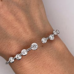 18ct White Gold Interlocking Diamond Bangle – 8 Natural Diamonds (1.30ct)