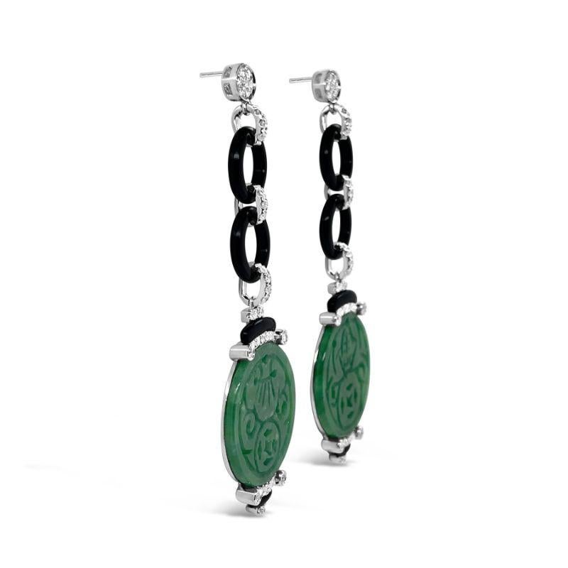 A beautifully designed pair of Jadeite and Diamond pendant earrings accompanies by black onyx hoops and scalloped plaques. 

The earrings measure 21mm x 69mm and feature post backs with butterfly clasp closures.
Total Jadeite Weight : 17.81ct
Total