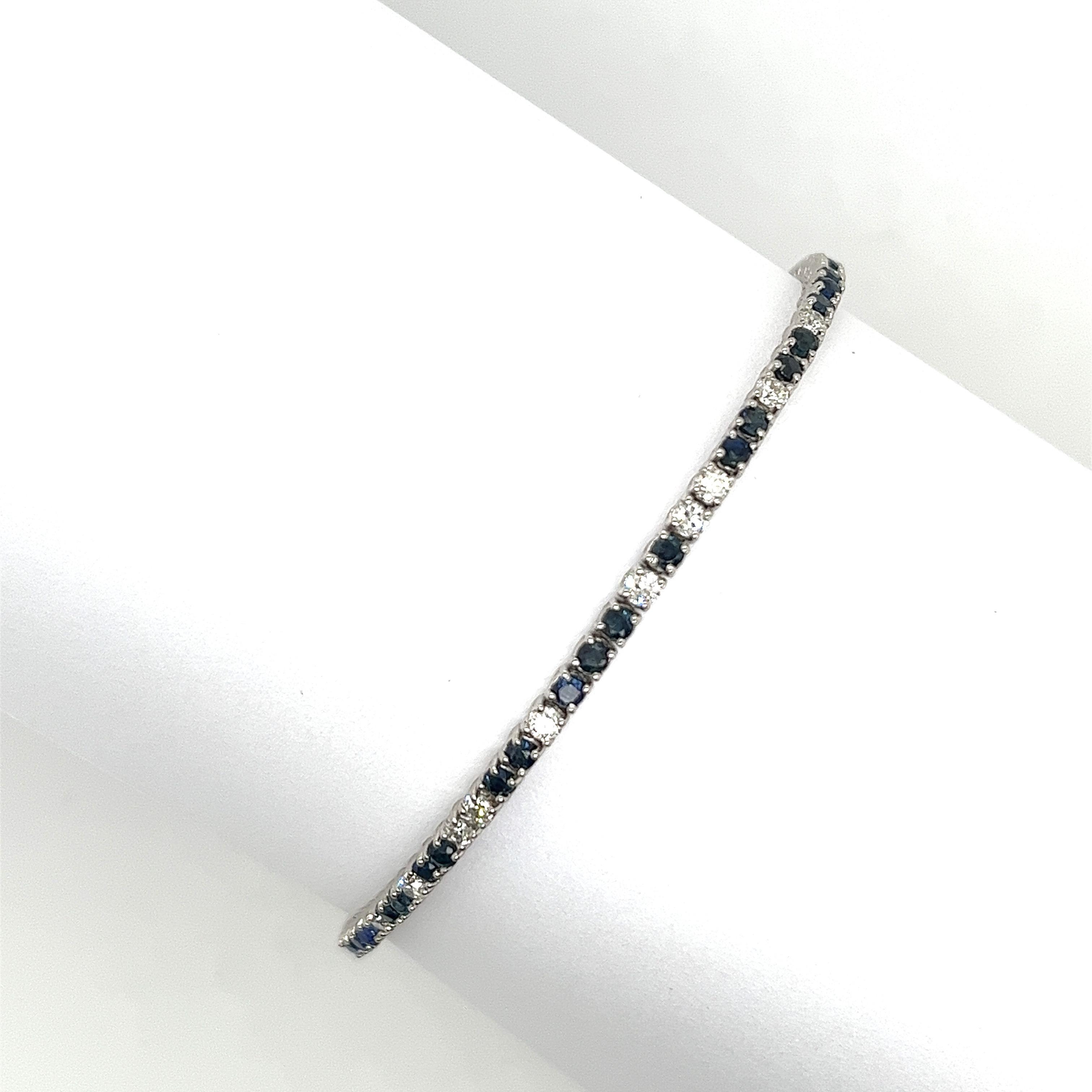 A beautiful diamond and sapphire tennis bracelet in 18ct white gold, 
features a total diamond weight of 1.05ct natural round brilliant cut diamonds SI1 clarity H colour and 42 round sapphires, 1.70ct.
This is a fantastic piece of jewellery that