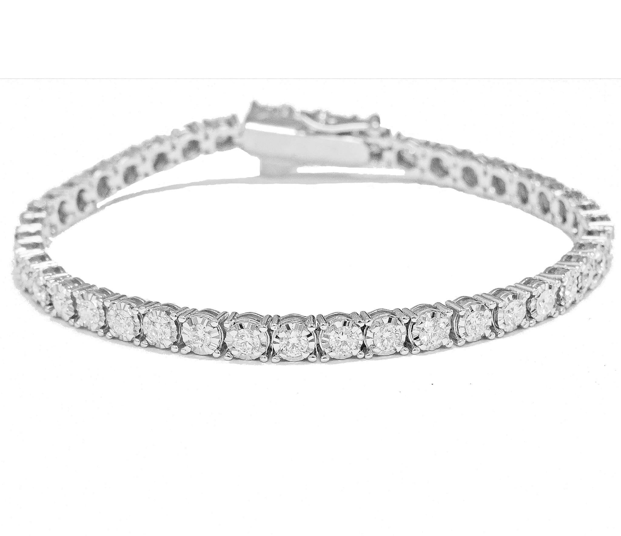 18ct white gold classic tennis bracelet

Can be ordered in 18ct yellow / 18ct white or rose gold

illusion set** ( stones are set surrounded by bright cut gold to make them appear bigger) 

13.30grams

0.93ct of high quality f/gsi diamonds

18ct