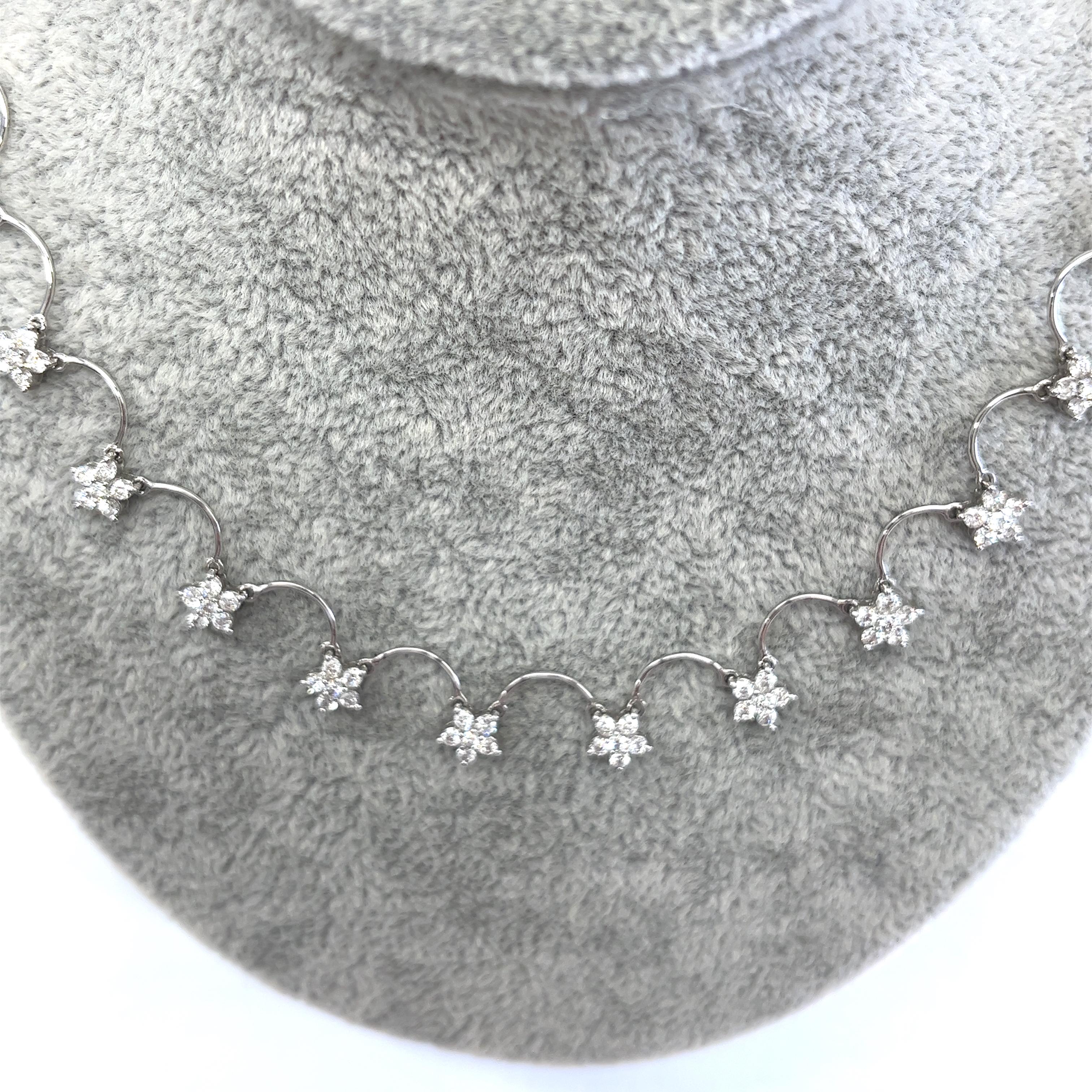 This necklace set features 2.0 natural round brilliant cut diamonds in cluster setting. The diamonds are set in 18ct white gold, and total length of the necklace is 17 inches. 
It is perfect for any occasion and is a great gift for a loved