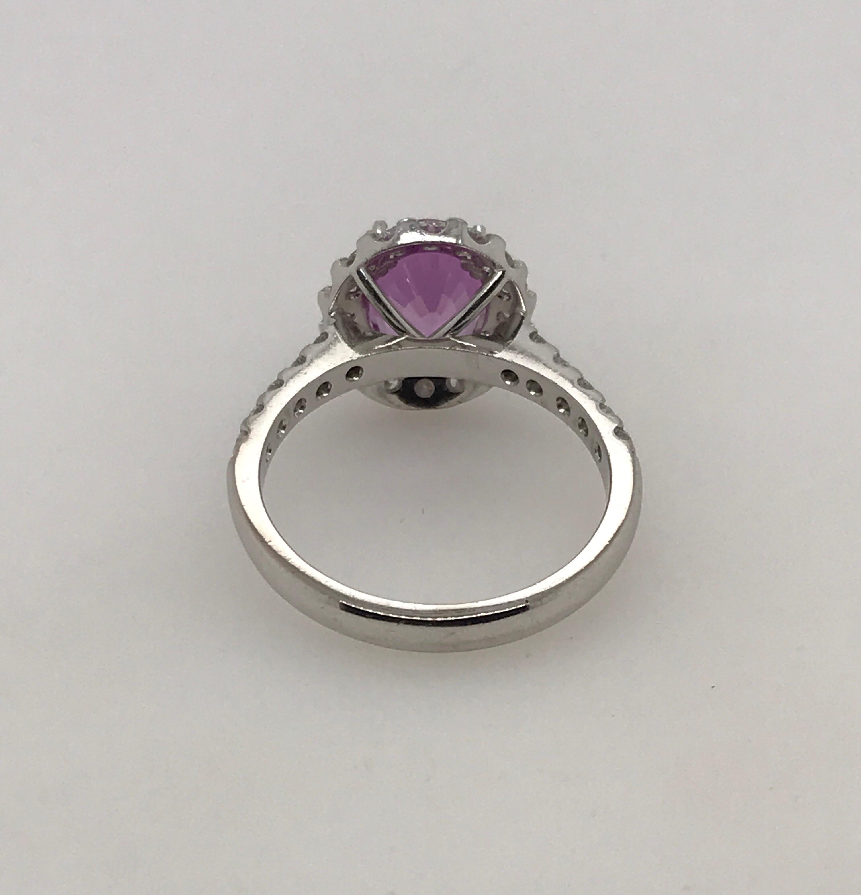 Modern 18 Carat White Gold Oval Pink Sapphire and Brilliant Cut Diamond Cluster Ring