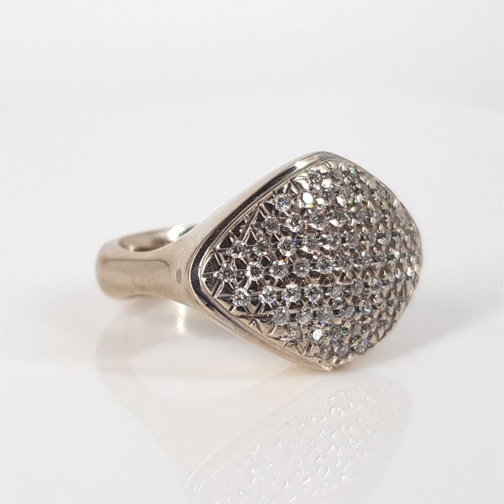 This Stunning Pave ring is set in 18carat white gold and weighs 13 grams.
This Ring features 63 Round Brilliant Cut Diamonds (GH vssi) weighing 0.67carat in total. The ring size is L¾ and can be resized.
