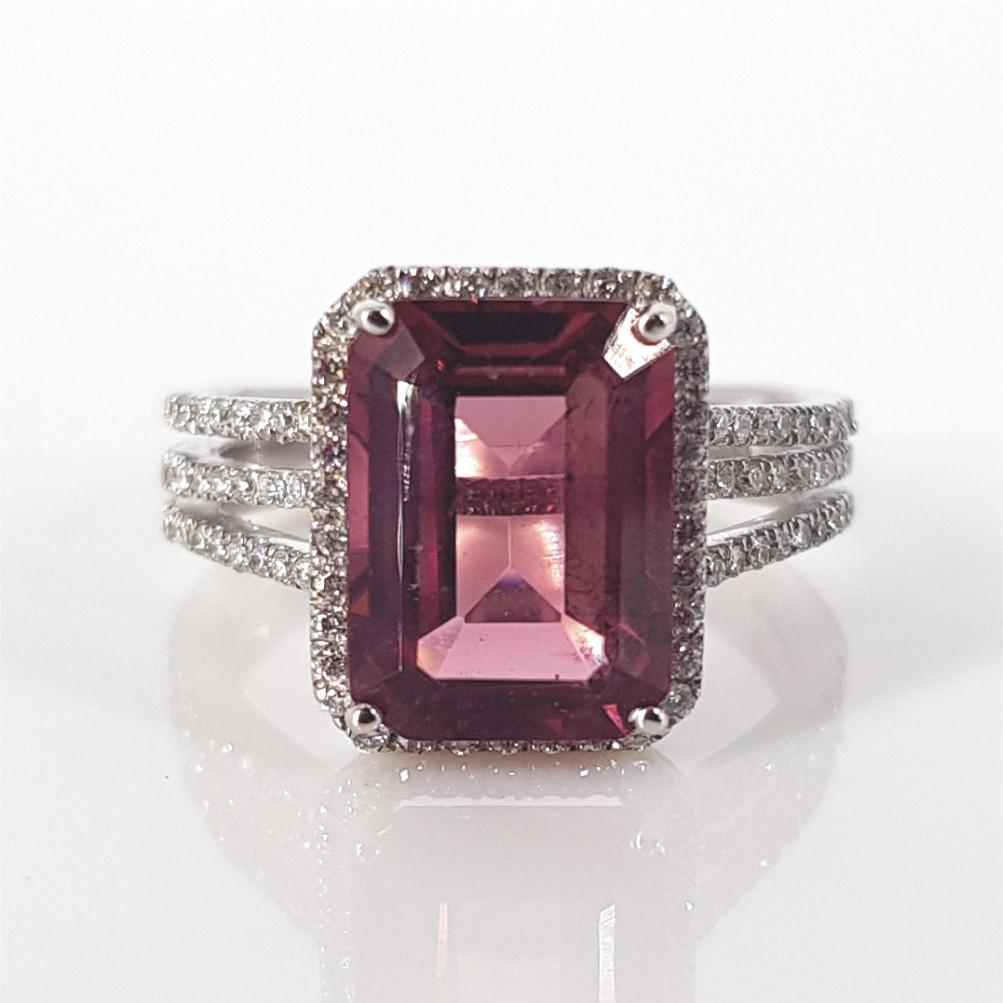 Set in 18carat White Gold and weighing 5.1 grams, this ring features 1 Emerald Cut Pink Tourmaline weighing an estimated 4.02 carat, and is 98 Round Brilliant Cut Diamonds (GH vs-si) weighing 0.49carat in total. The ring size is an L ½ 