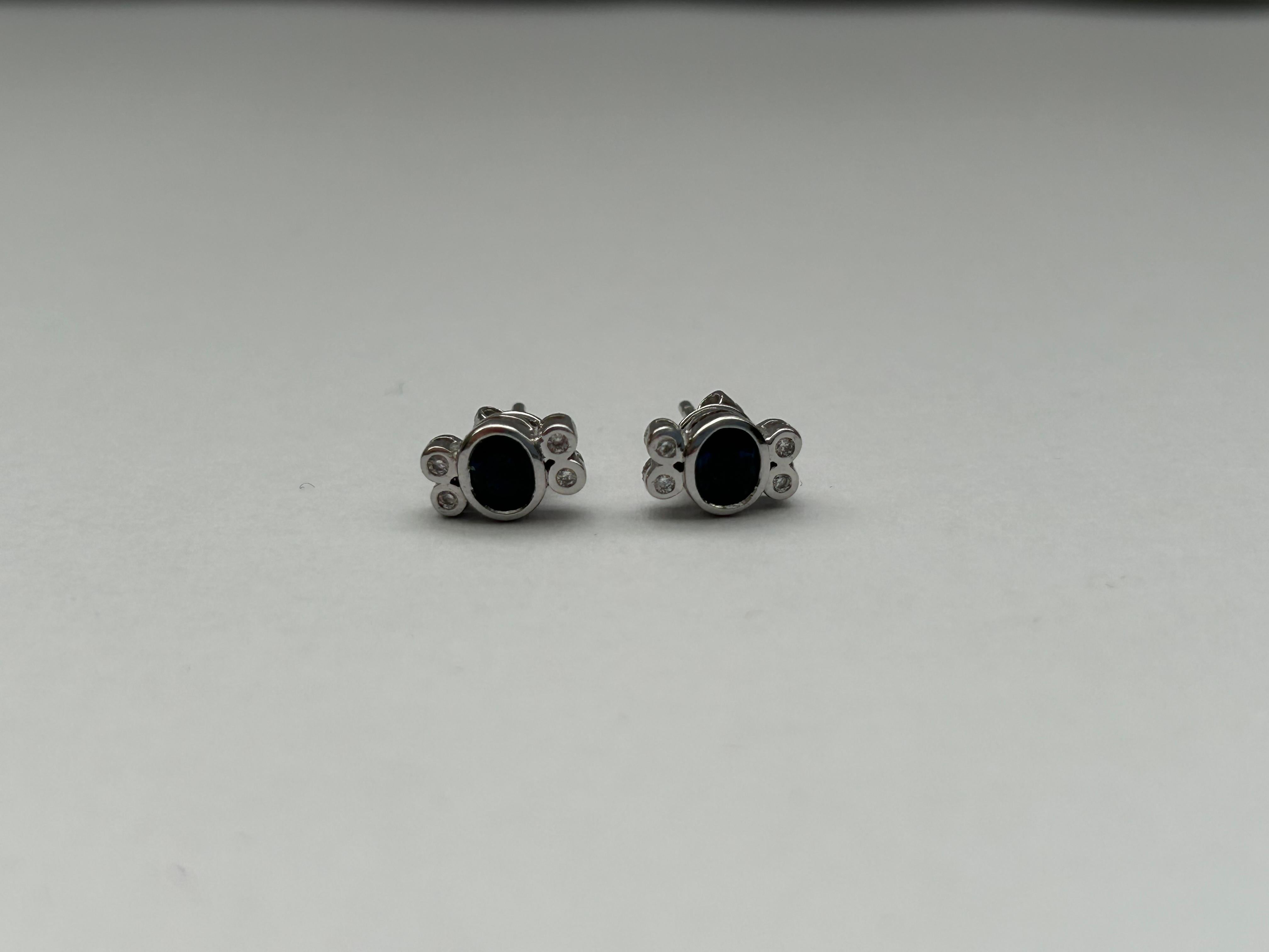These elegant diamond and sapphire ear studs are set in 18ct white gold and measure 10mm x 6mm.