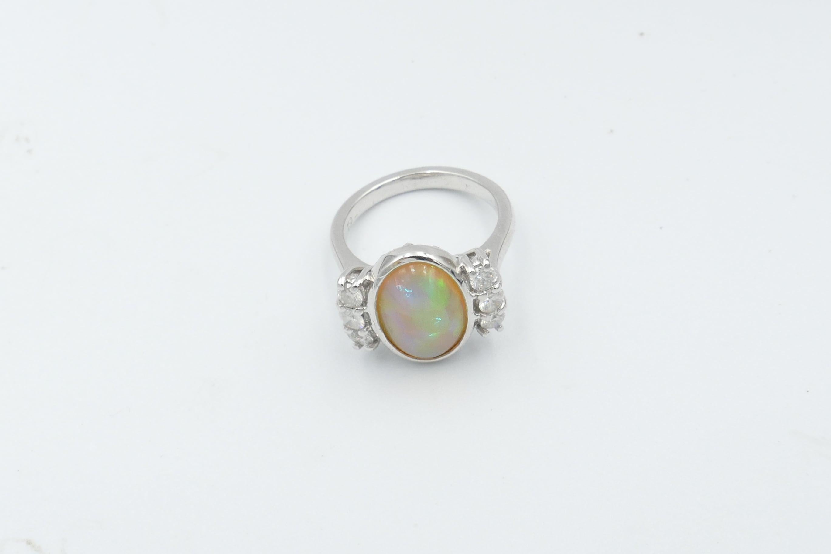 Oval Cut 18 Carat White Gold Solid Opal and Diamond Ring For Sale