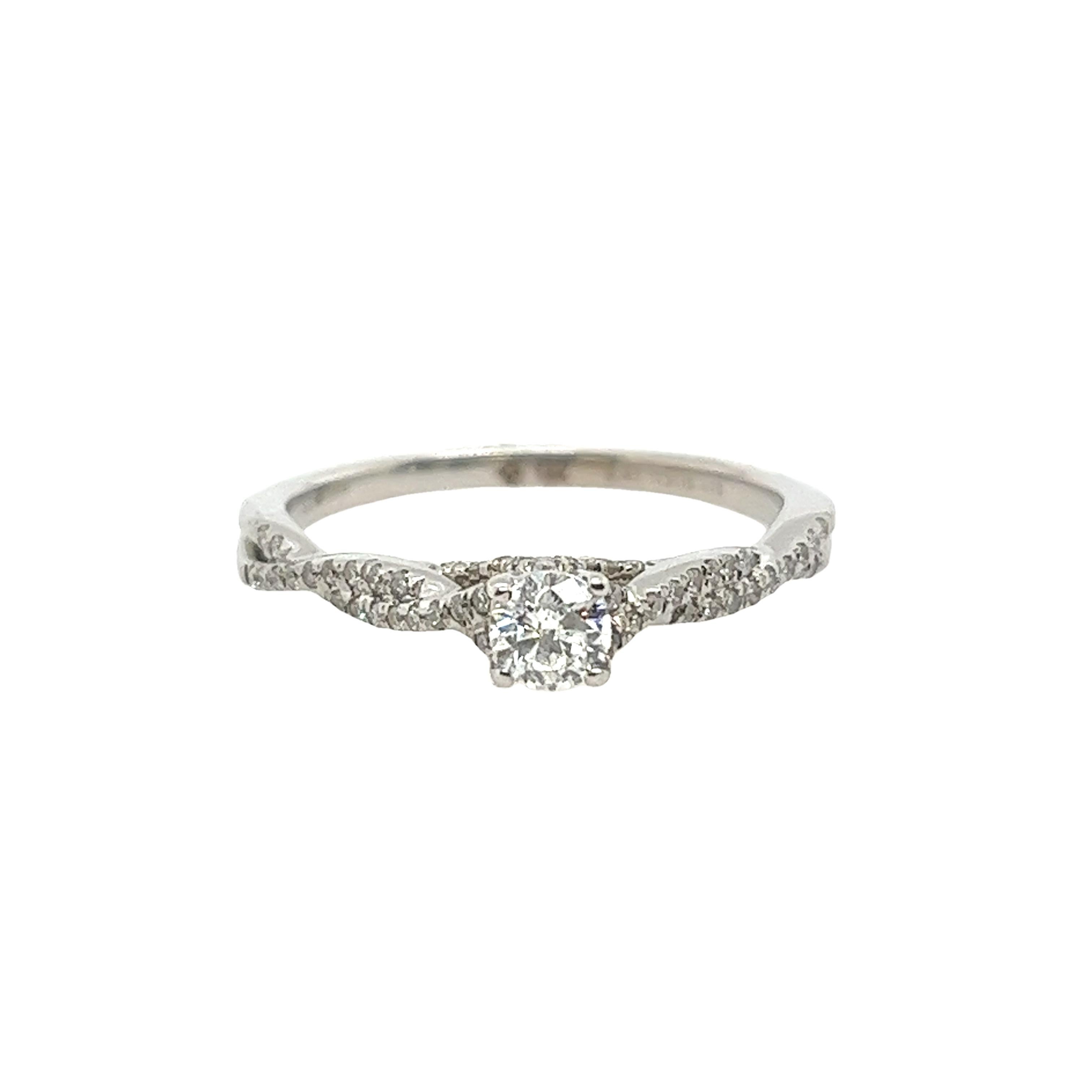 This preloved classic solitaire round brilliant-cut diamond ring is a round brilliant cut 0.23ct G/I1 and diamonds on shoulders 0.18ct H-I/I1 set with a total of 0.41ct diamonds. A timeless symbol of everlasting love.

Total Diamond Weight: