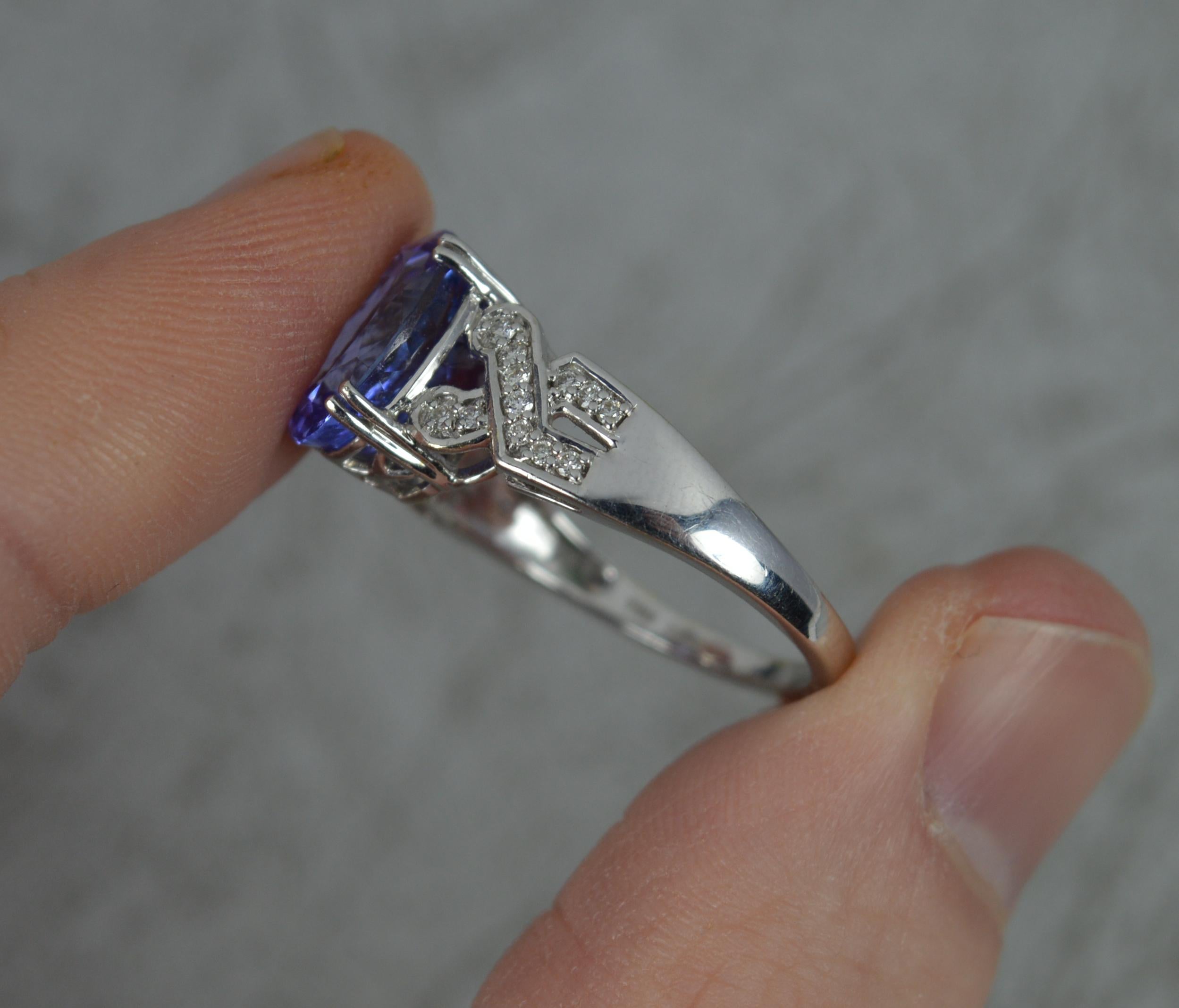 Oval Cut 18ct White Gold Tanzanite and Diamond Engagement Cluster Ring