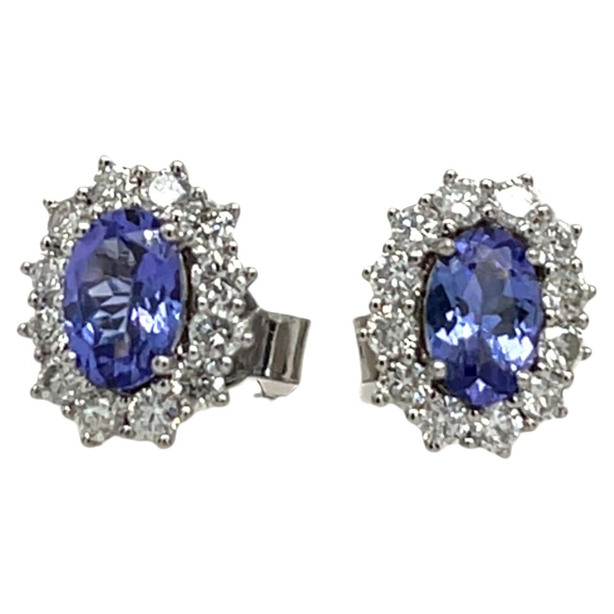 Orecchini a bottone in oro bianco 18 carati con tanzanite e diamanti a corona