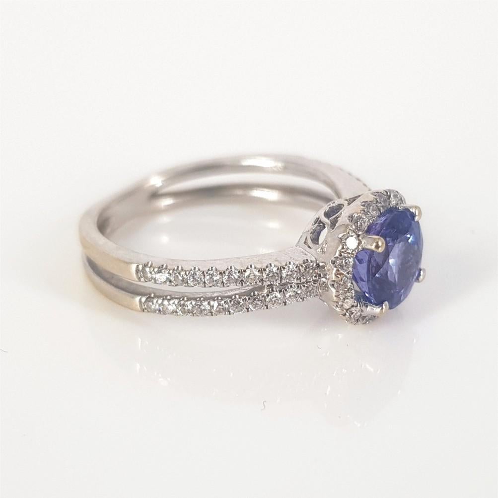 This elegant and beautifully crafted piece is set in 18carat white gold weighing 4 grams.
This Ring features 1 RBC Tanzanite weighing 1.0carat, and is surrounded by 58 RBC Diamonds (GH vssi) weighing 0.29carat in total. The ring size is 5.5
