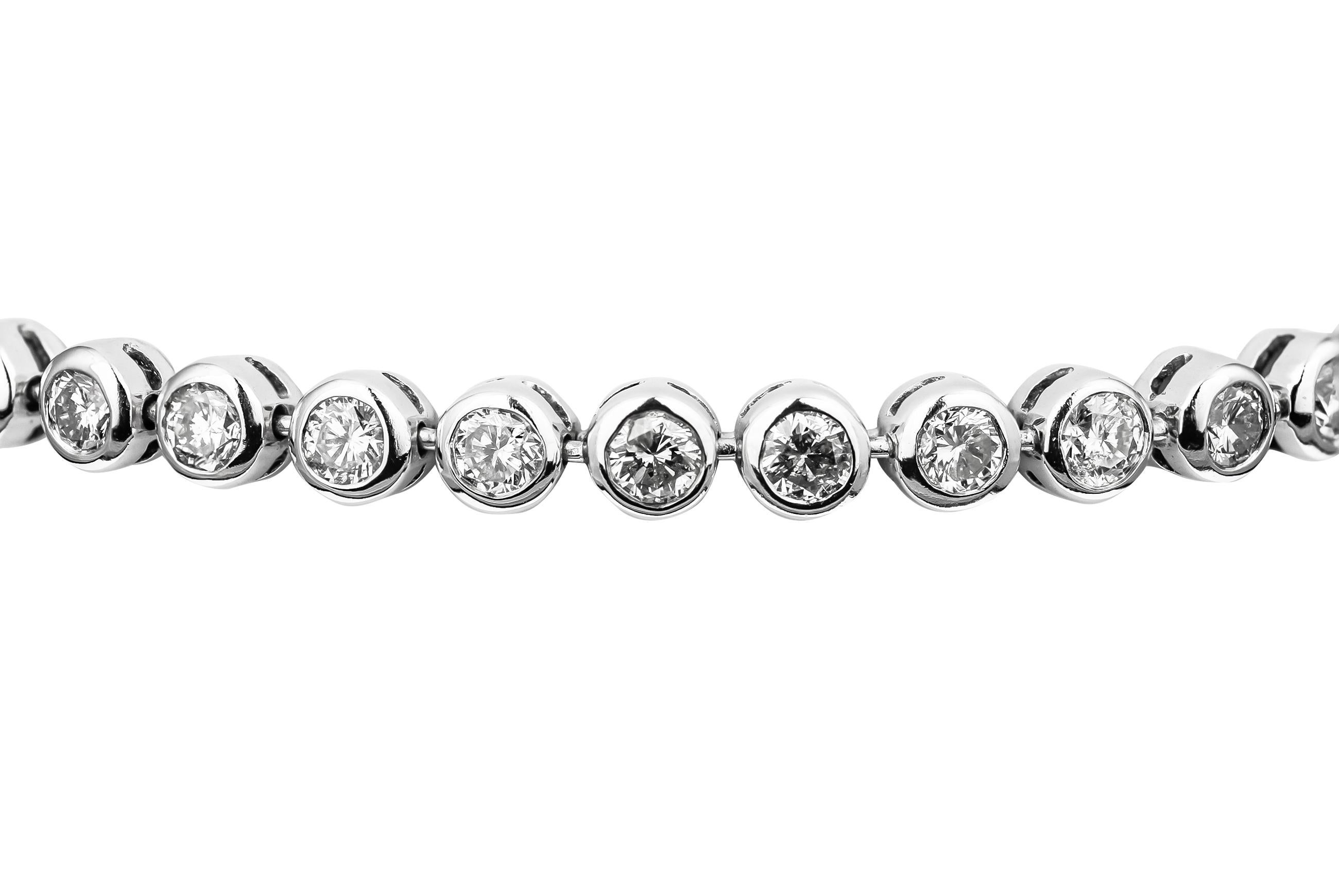 18ct white gold tennis braclet featuring 34 round brilliant cut diamonds of H/I/J colour, pique clarity weighing a total of 3.40cts in  a smooth rubover setting.
With a safety clasp for security, the bracelet weighs a total of 12.6g.

A smooth and