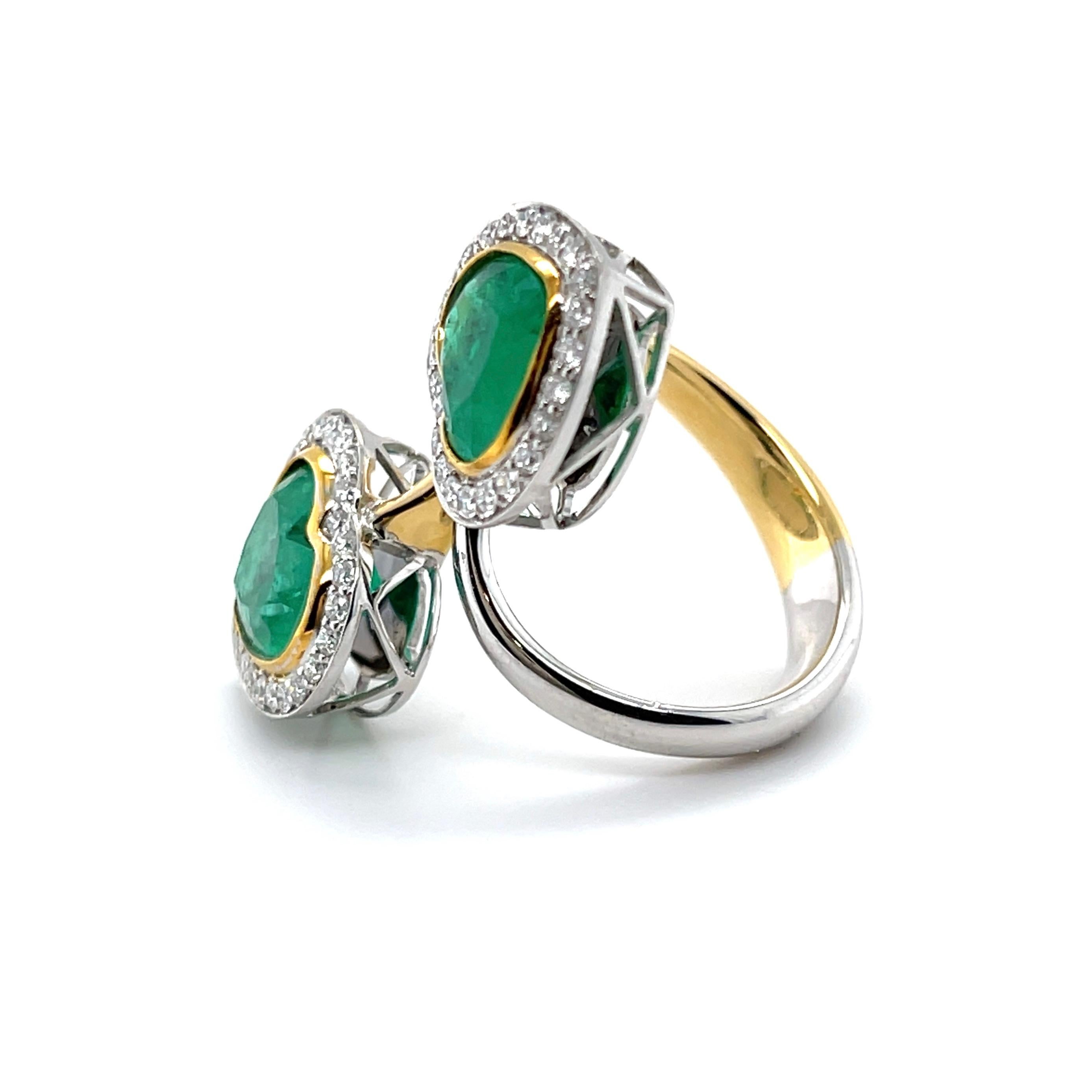 pair of heart cut Colombian (based on my opinion) emerald, crafted with eighteen karat yellow and white gold. featuring a beatutiful selection of fifty bead set natural round brilliant cut diamonds, complimented with a polished finish