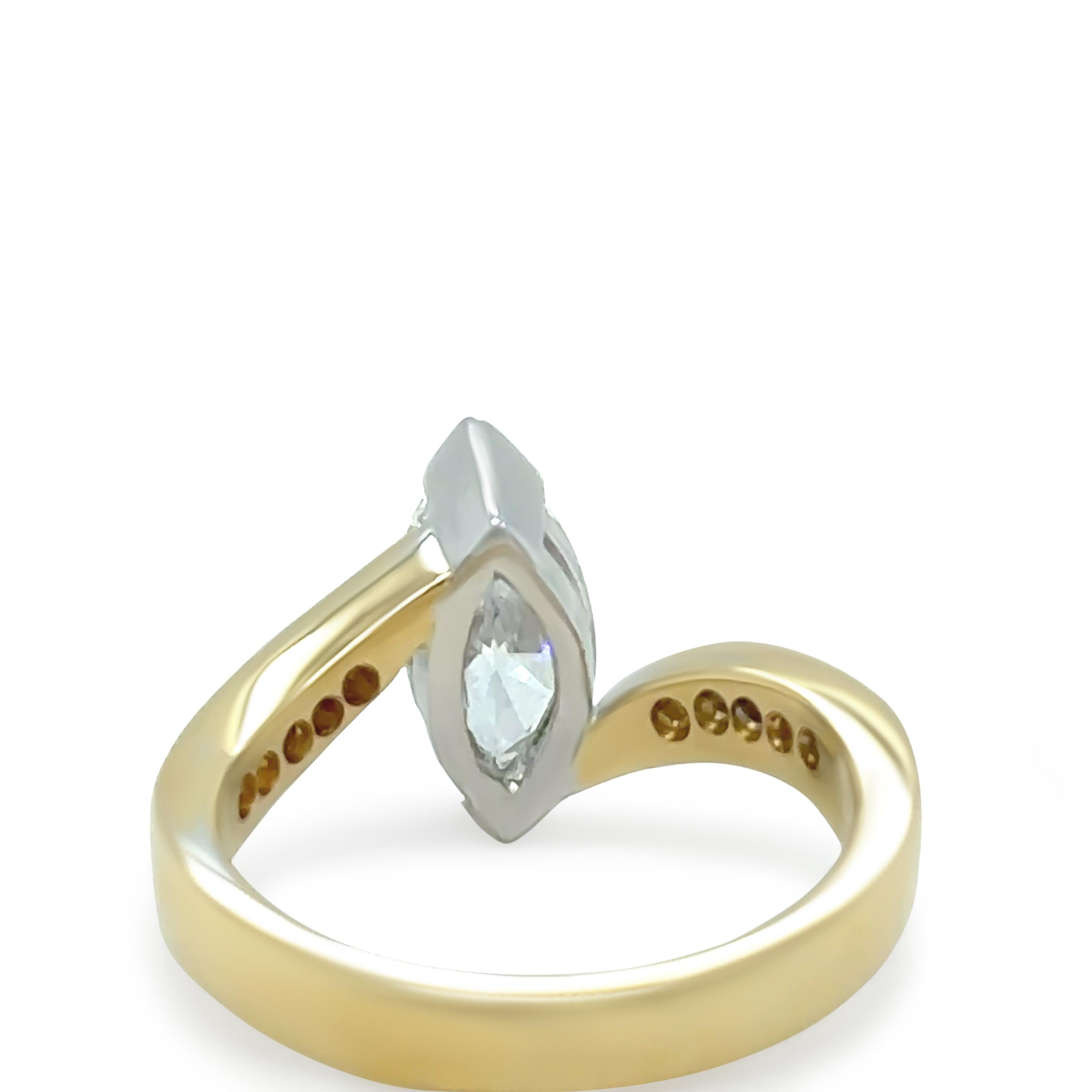 This exquisite 18ct yellow gold engagement ring features a 1.01ct marquise-cut diamond, securely set in a white gold double bezel with ‘V’ end claw setting. The centre diamond is F colour and VS1 clarity, offering exceptional brilliance and quality,