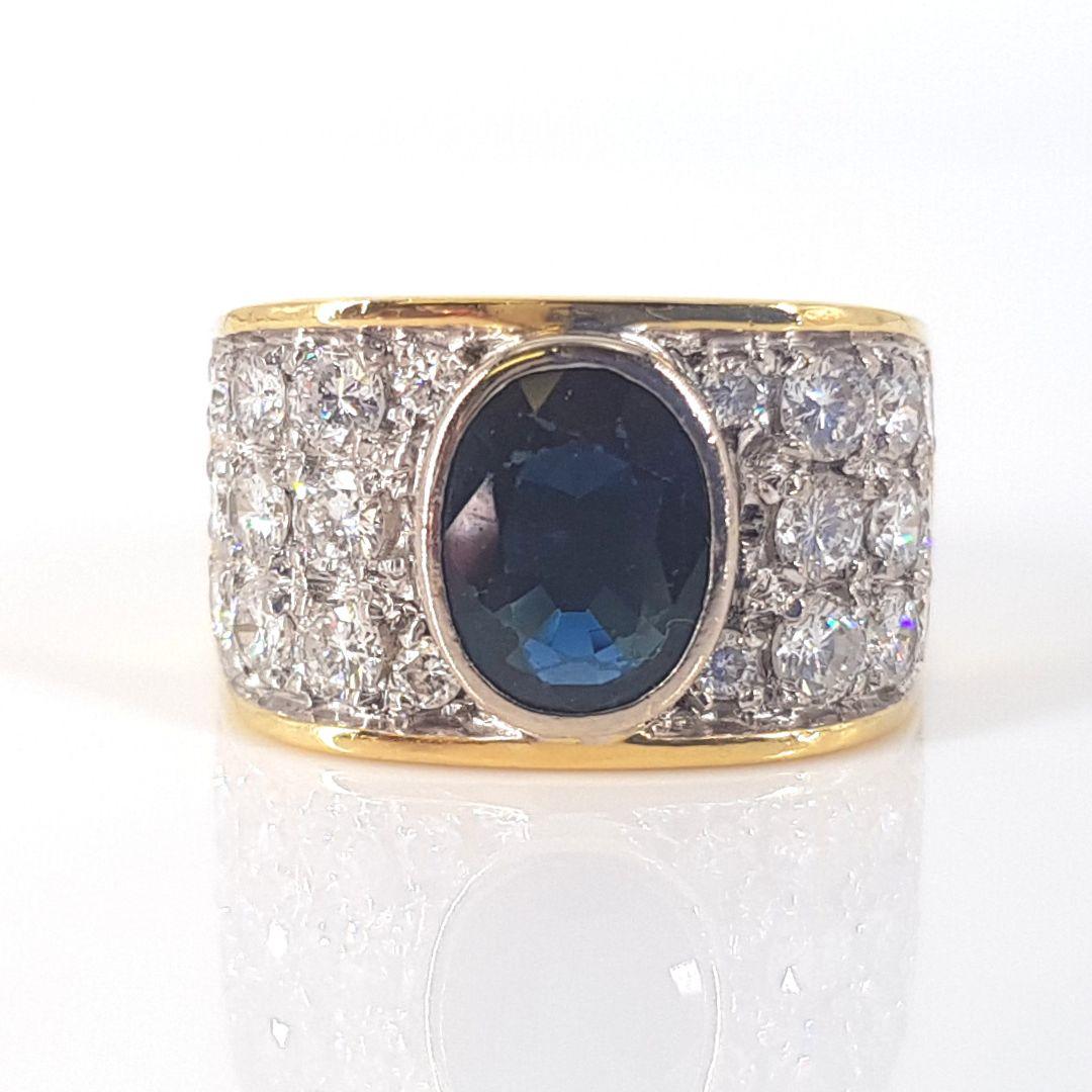 Oval Cut 18 Carat Yellow and White Gold Sapphire and Diamond Ring For Sale