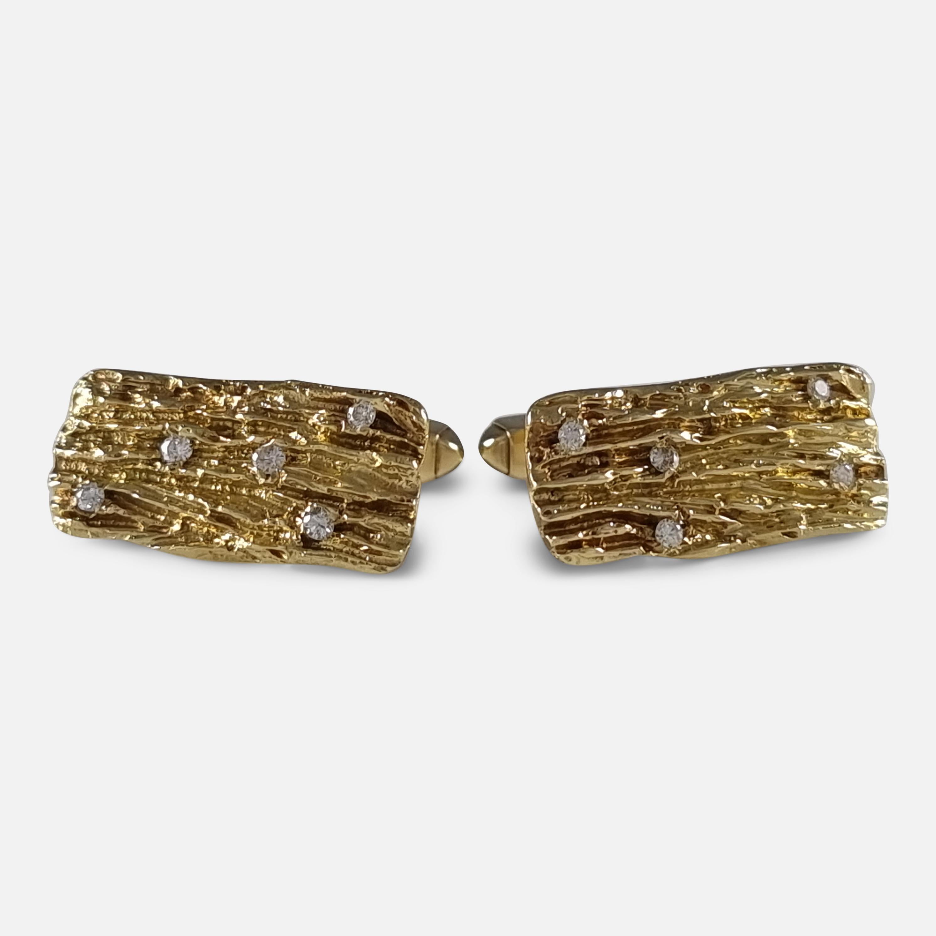 A pair of 18ct yellow gold cufflinks from 1968, featuring rectangular plaques with a textured bark finish and five eight-cut diamonds, attached to swivel T-bar terminals. 

Period: - Late 20th Century.

Date: - London, 1968.

Maker: - Maker’s mark