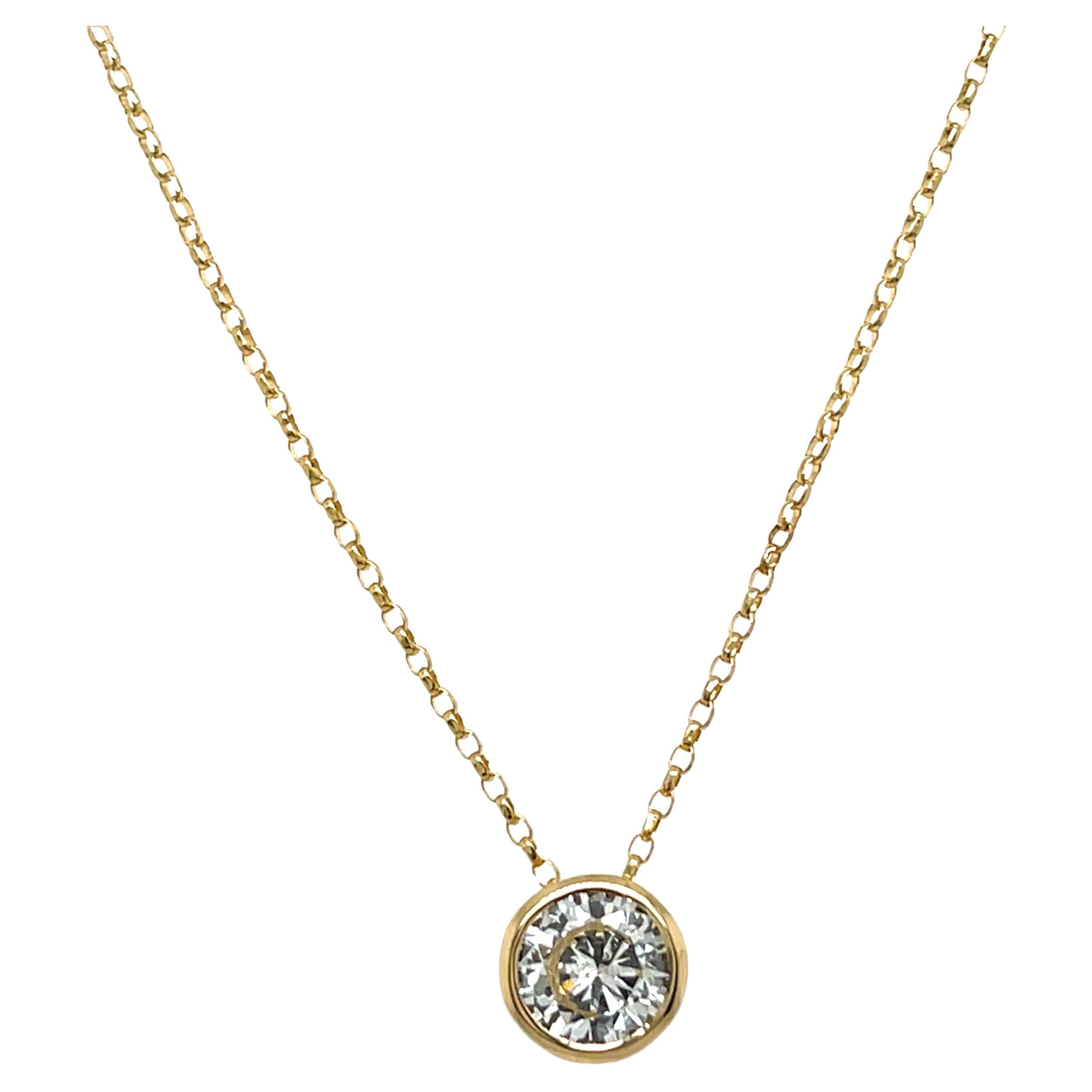 Pendentif en or jaune 18ct avec un diamant de 0,94ct suspendu à une chaîne de 16".