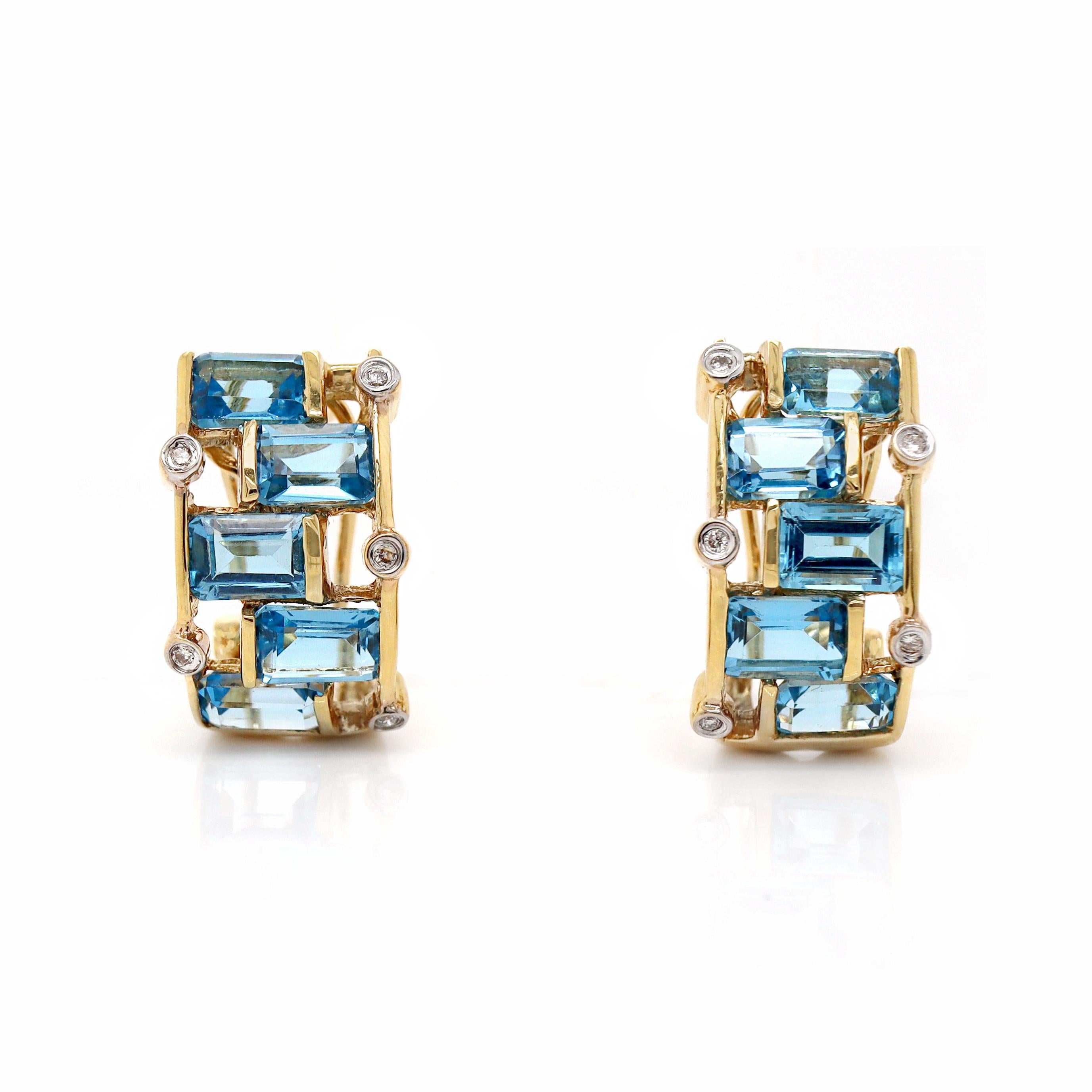 18ct Yellow Gold Blue Topaz & Diamond Earrings

These elegant 18ct yellow gold earrings feature a striking geometric design, incorporating vibrant blue topaz stones complemented by dazzling diamonds. The topaz, with its rich hue, is set in clean,