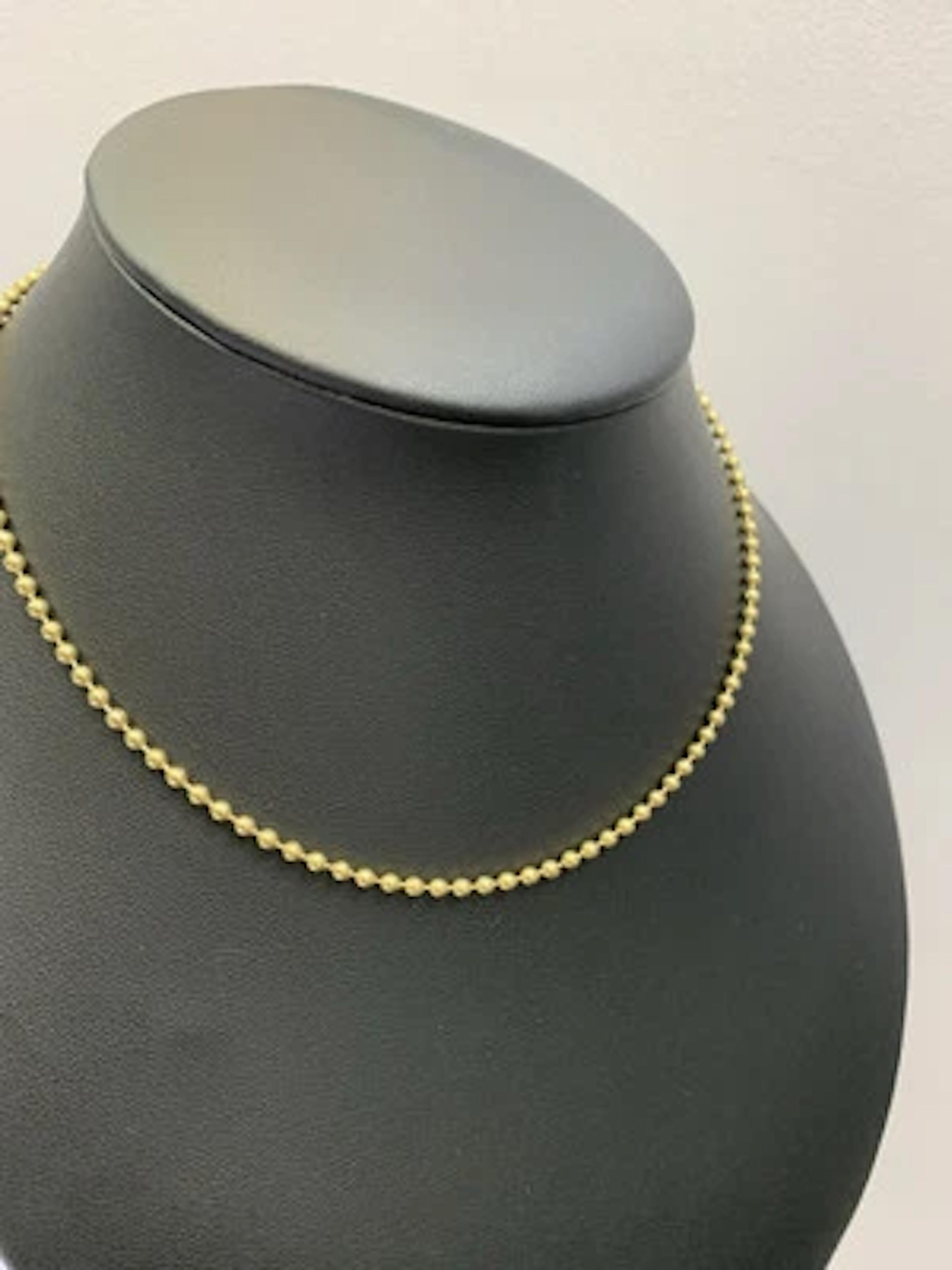 This is an 18ct yellow gold chunky ball chain necklace measuring 15.5 inches and weighing 8.0g. The necklace features a ball closure and is crafted from yellow gold with a chain style. It does not have a main stone and is of a gold colour. Box and